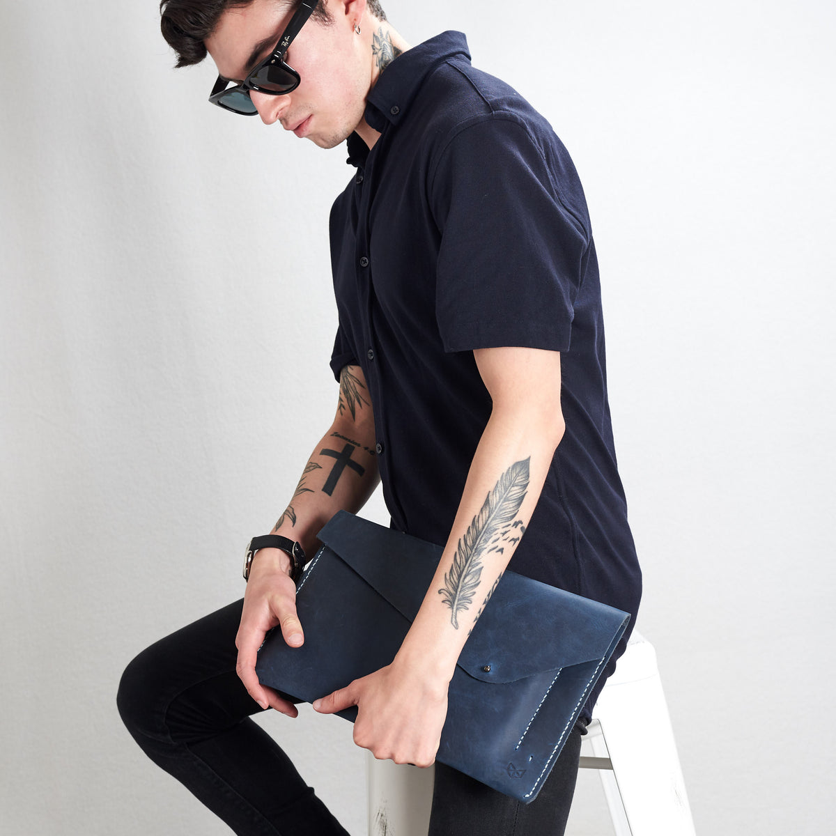Style holding case by side. Blue draftsman 5 case by Capra Leather. Google pixel sleeve.