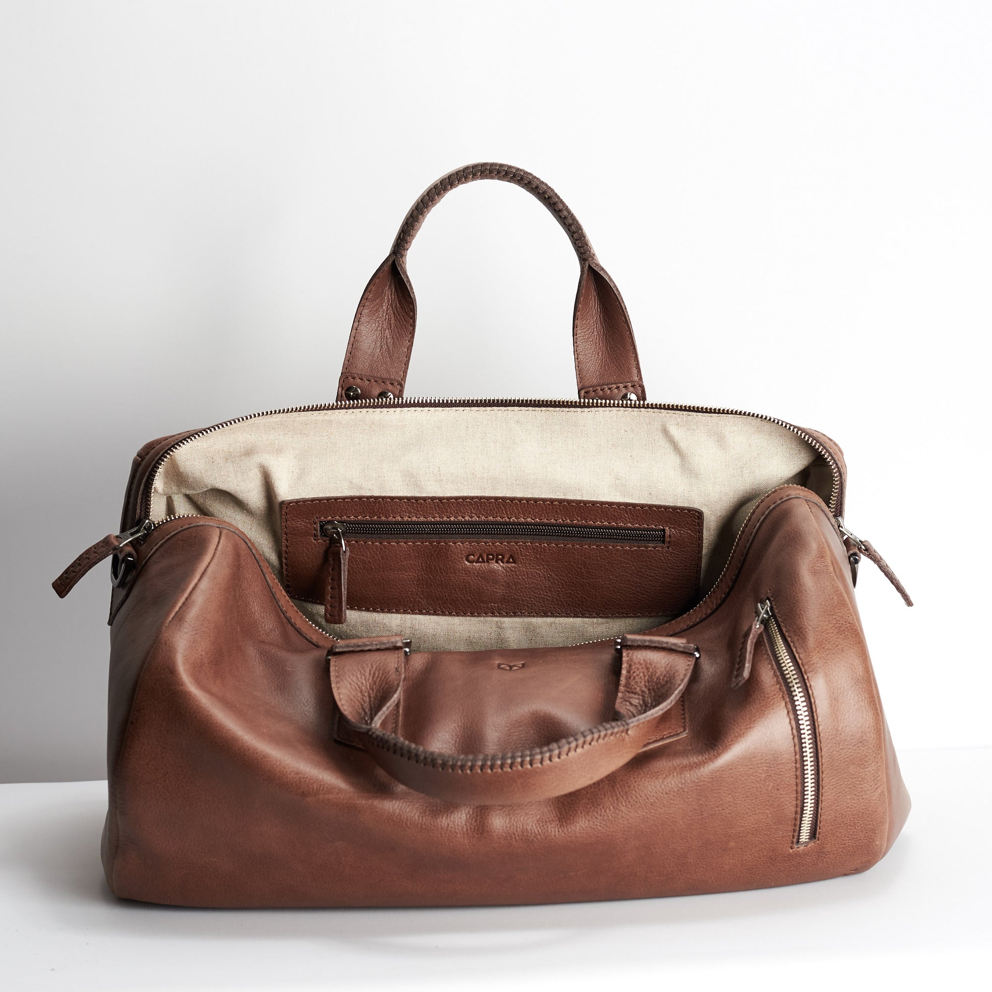 Linen interior. Brown leather handbag duffle bag for men