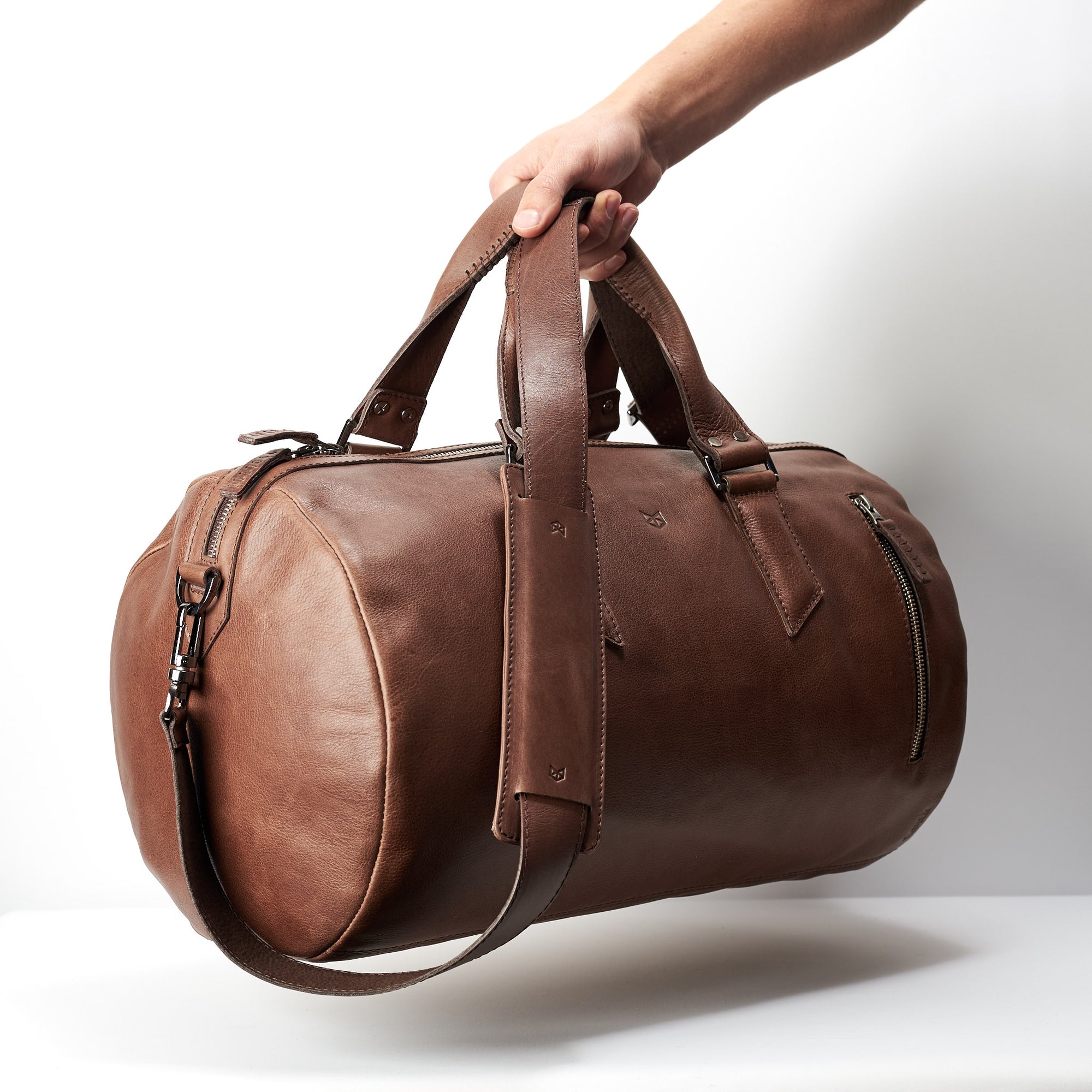 Style photo. Brown leather duffle bag for mens gifts. Shoulder gym bag