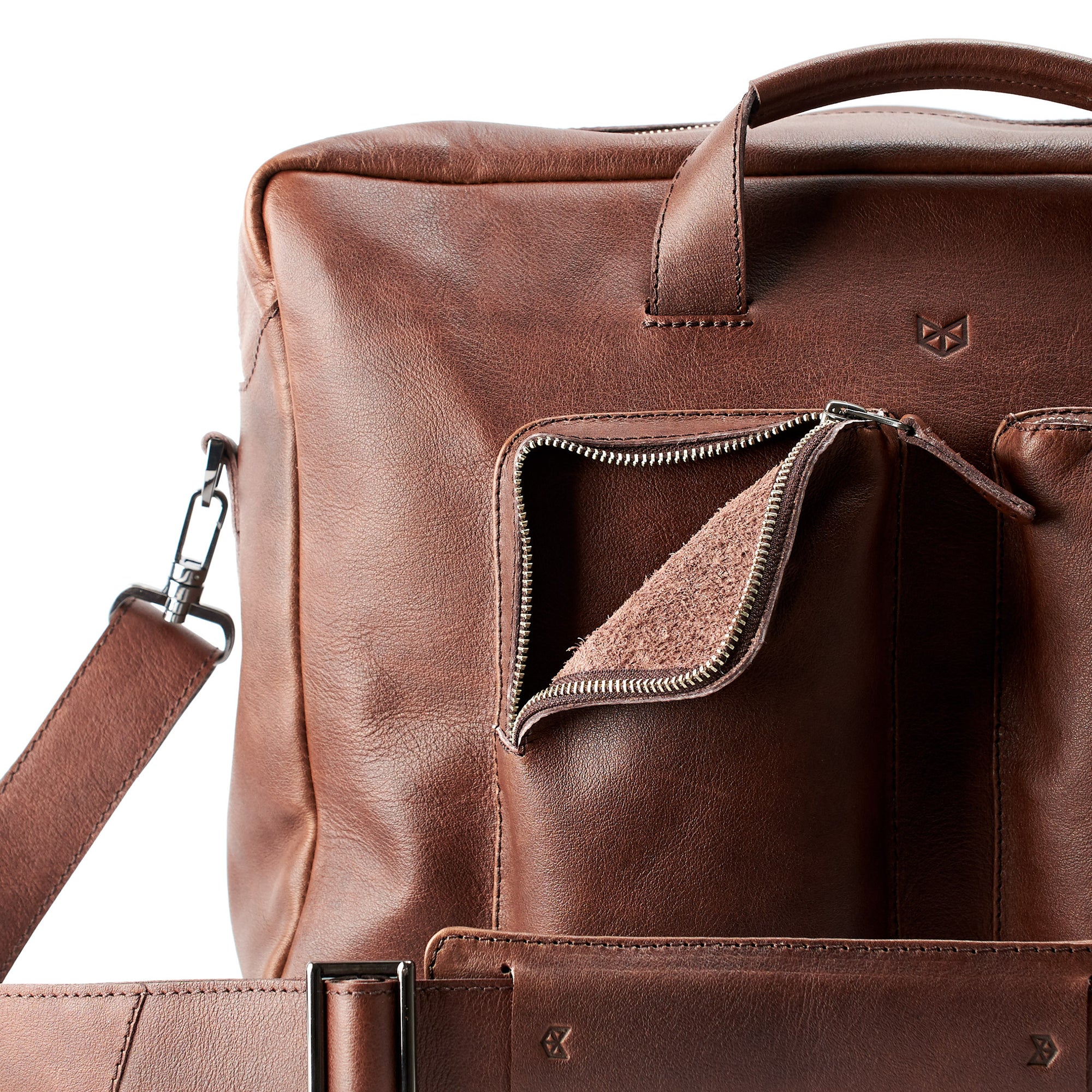 Soft pocket interior.  Brown handmade leather messenger bag for men.