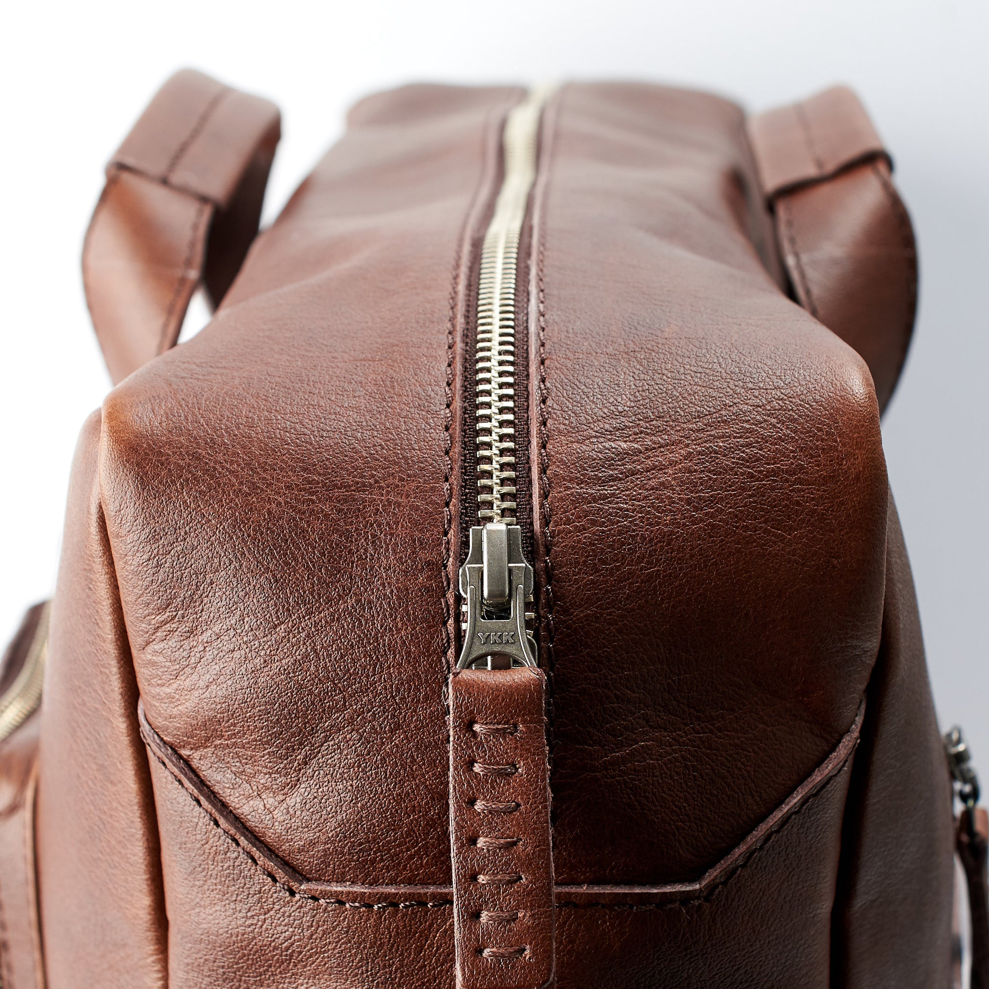 Zipper detail. Hand stitched pull tabs. Brown handmade leather messenger bag for men. Commuter bag, designer mens bag 