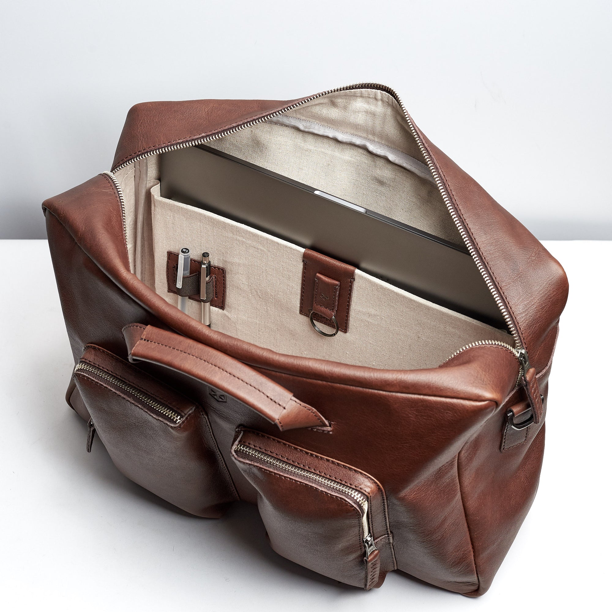 Linen interior.  Brown handmade leather messenger bag for men. Macbook Pro 13inch 15 inch interior pocket