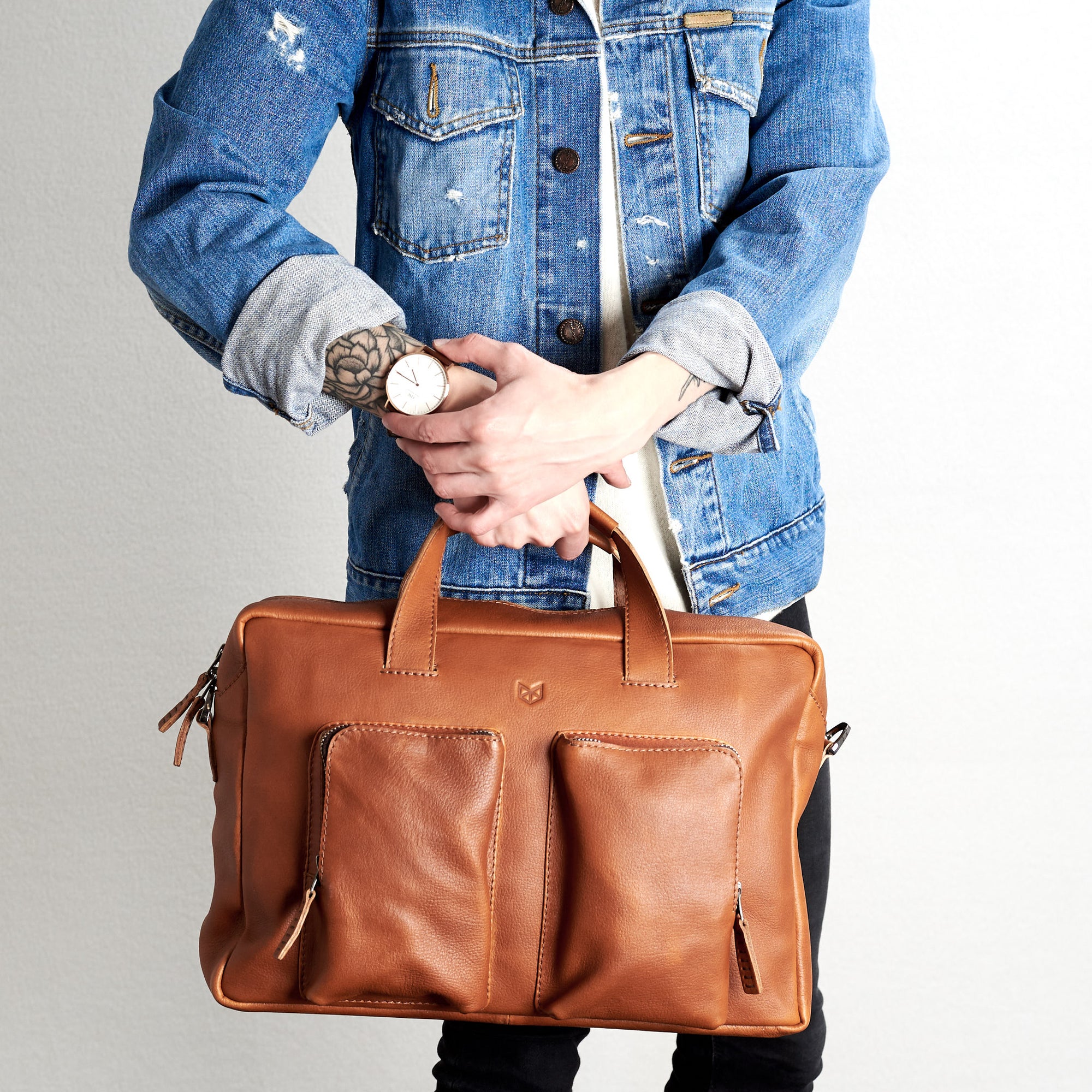 Front view. Tan handmade leather messenger bag for Men by Capra Leather. Tech bag, mens weekender bag 