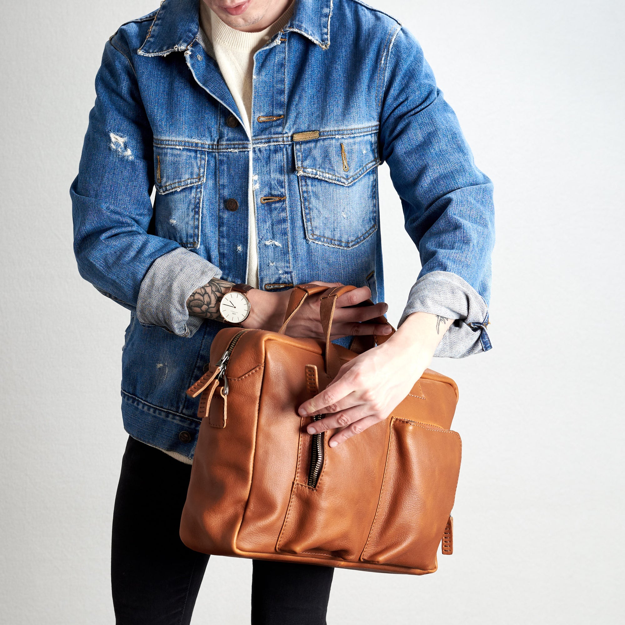 Style from pocket use. Tan Equz messenger bag by Capra Leather. 