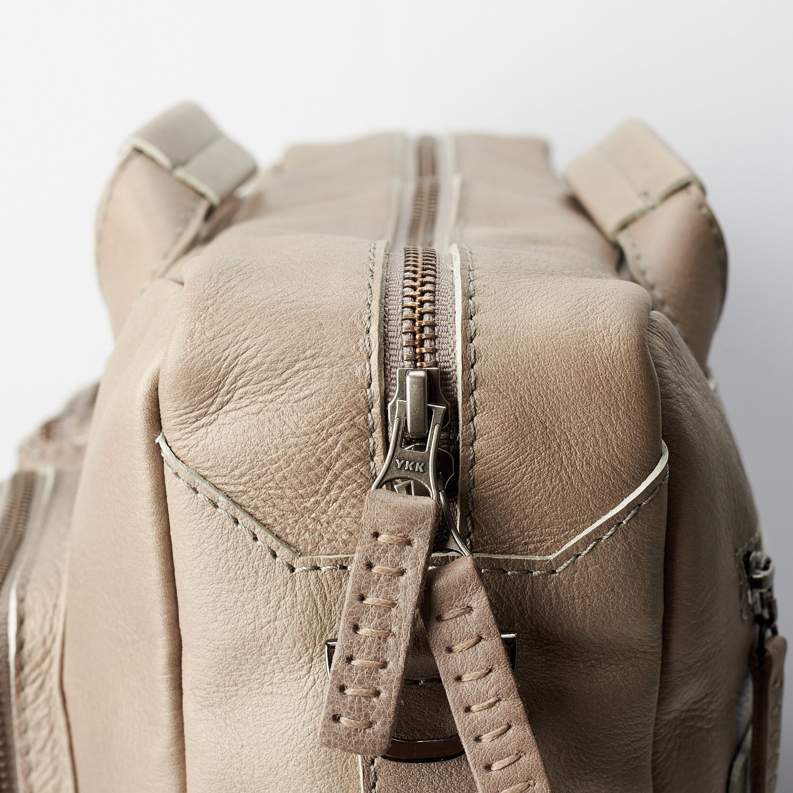 Zipper and hand stitched zipper pull tab. Grey handmade leather messenger bag for Men by Capra Leather. Commuter bag, mens weekender bag 