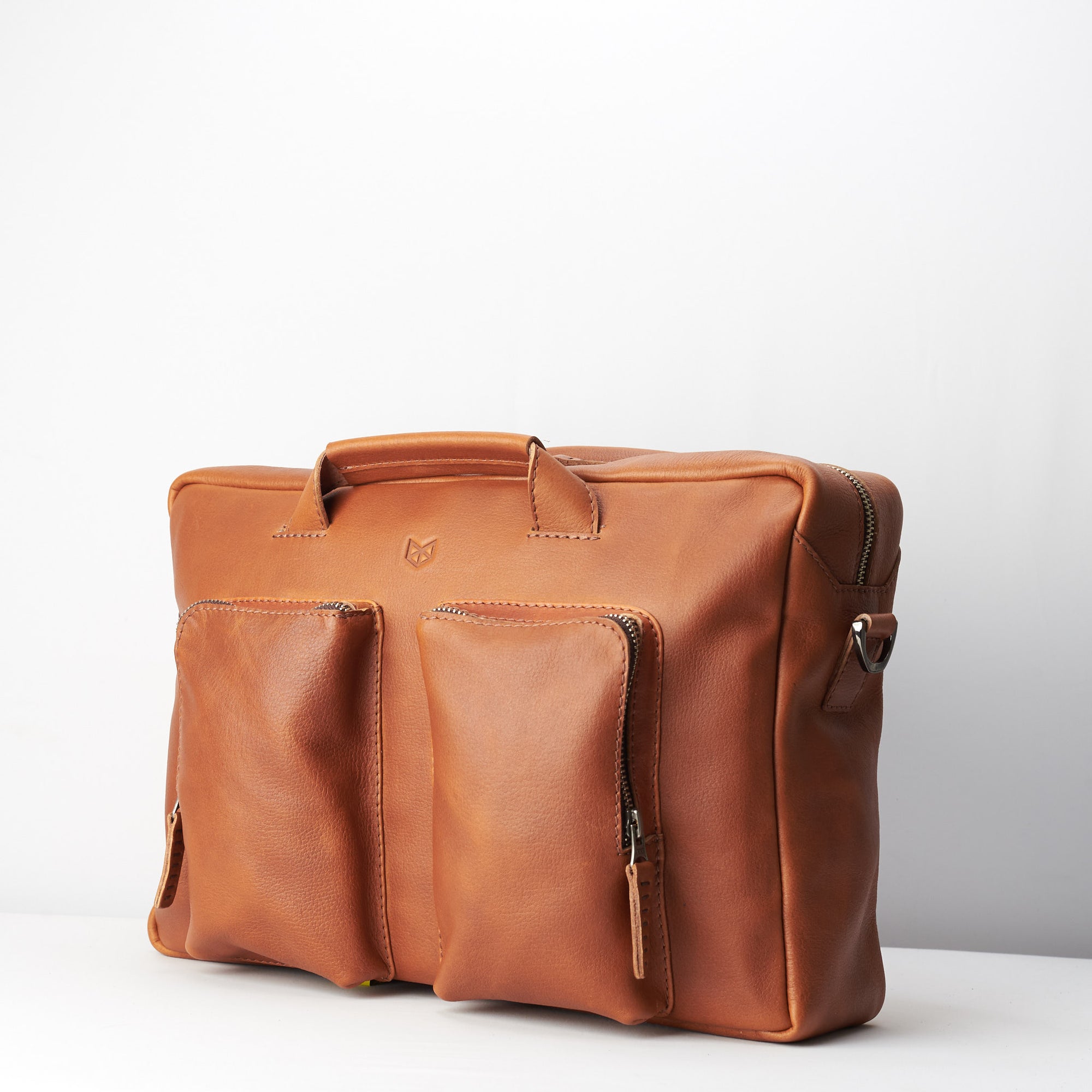 two front pockets. Tan handmade leather messenger bag for Men by Capra Leather. Tech bag, mens weekender bag 