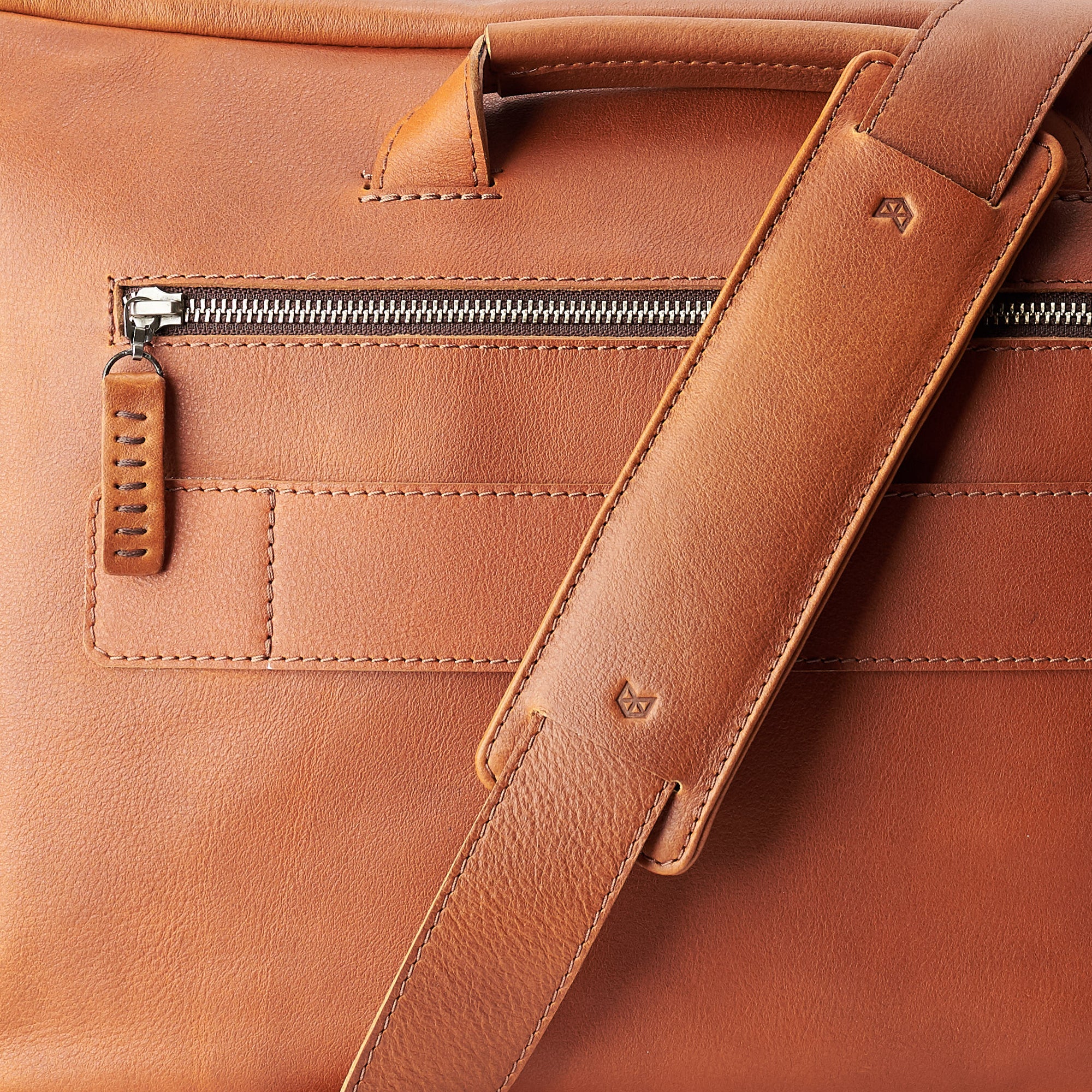 Detail Tan handmade leather messenger bag for Men by Capra Leather. Tech bag, mens weekender bag 