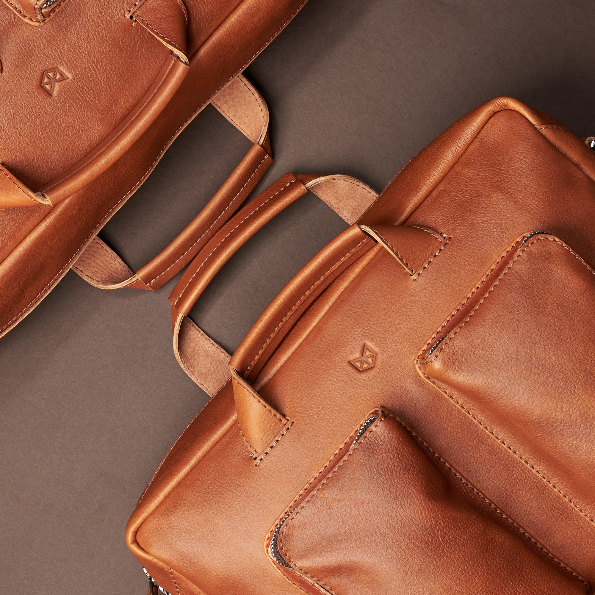two-size bag. Tan handmade leather messenger bag for Men by Capra Leather. Tech bag, mens weekender bag 