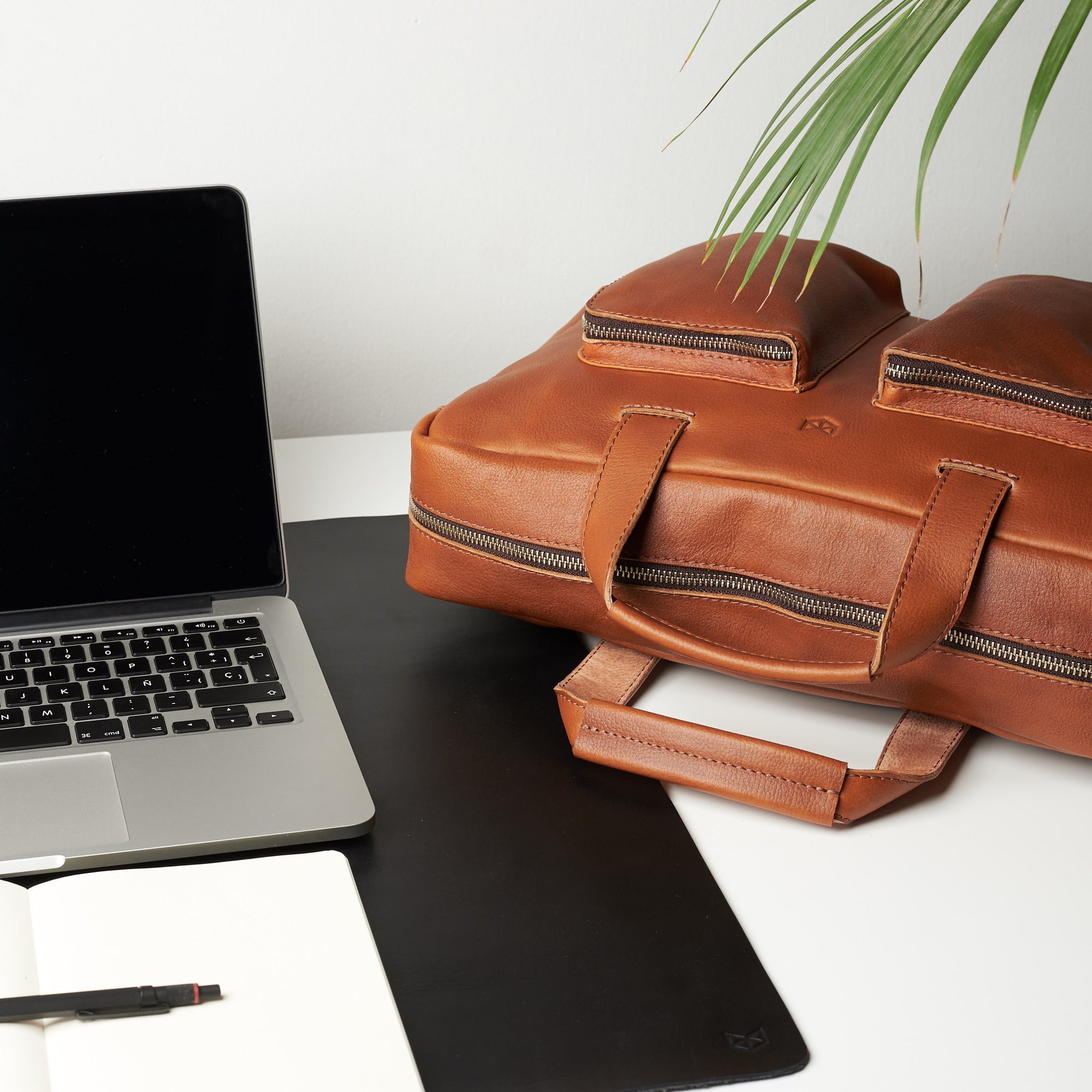 Desk styling. Tan handmade leather messenger bag for Men by Capra Leather. Tech bag, mens weekender bag 