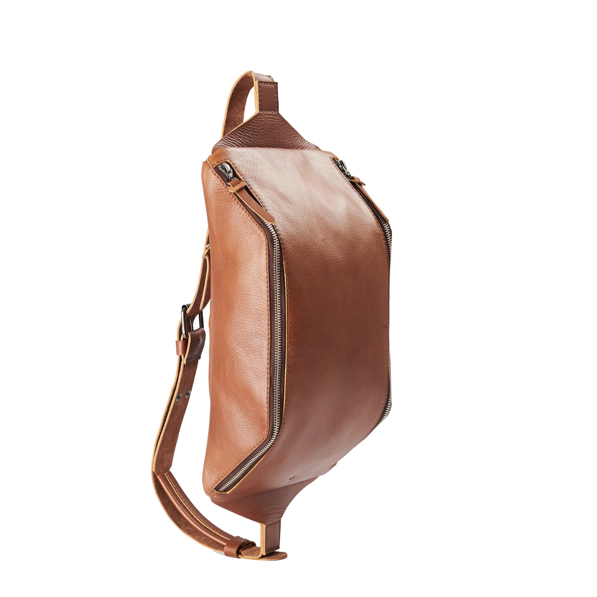 Tan Fenek sling bag backpack made by Capra Leather. Styling of over the shoulder bag in use. 