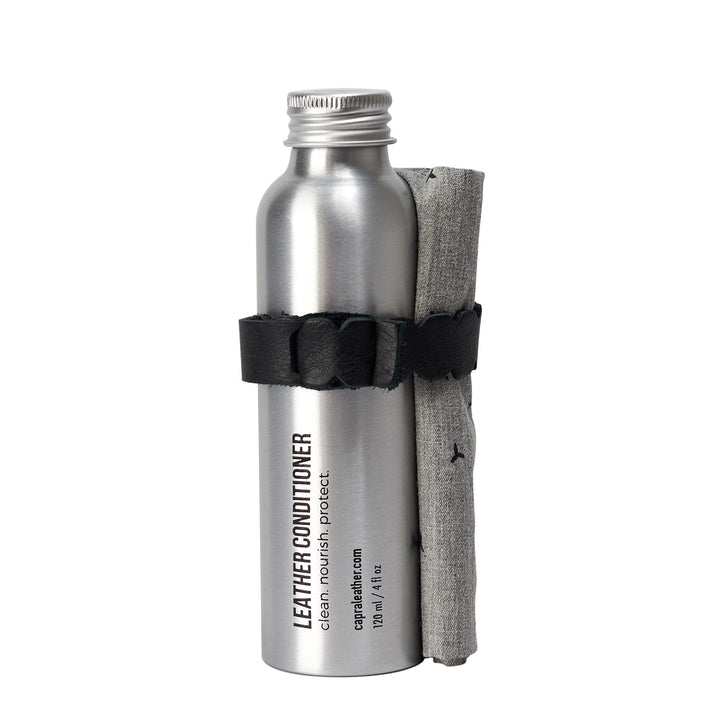 Cover. Leather conditioner cream kit to  condition, restore, nourish, protect and prolong the life of your leather products. Moisturizing cream for leather care. Reusable aluminium bottle. 