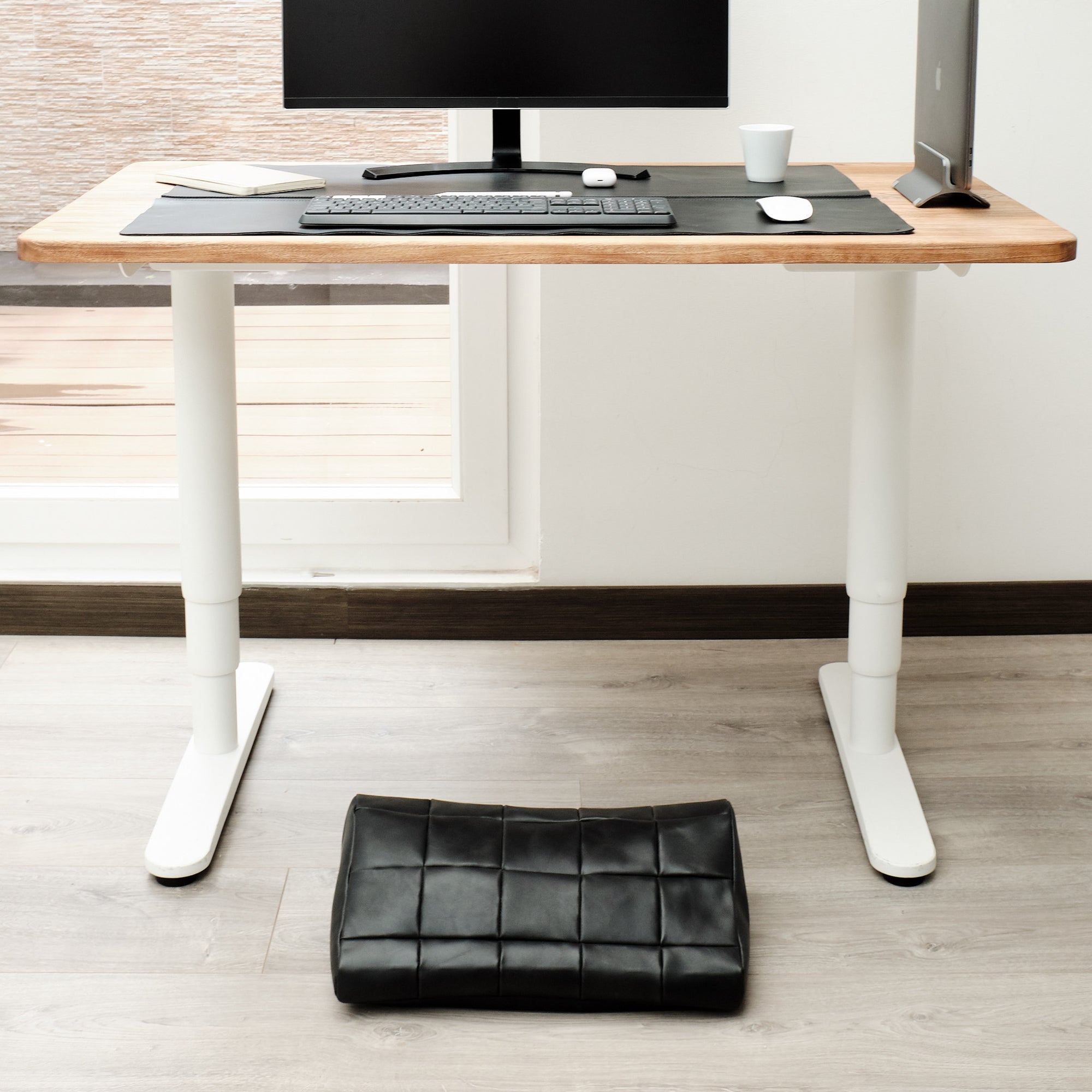 Home office. Ergonomic under desk footrest cover in black by Capra Leather
