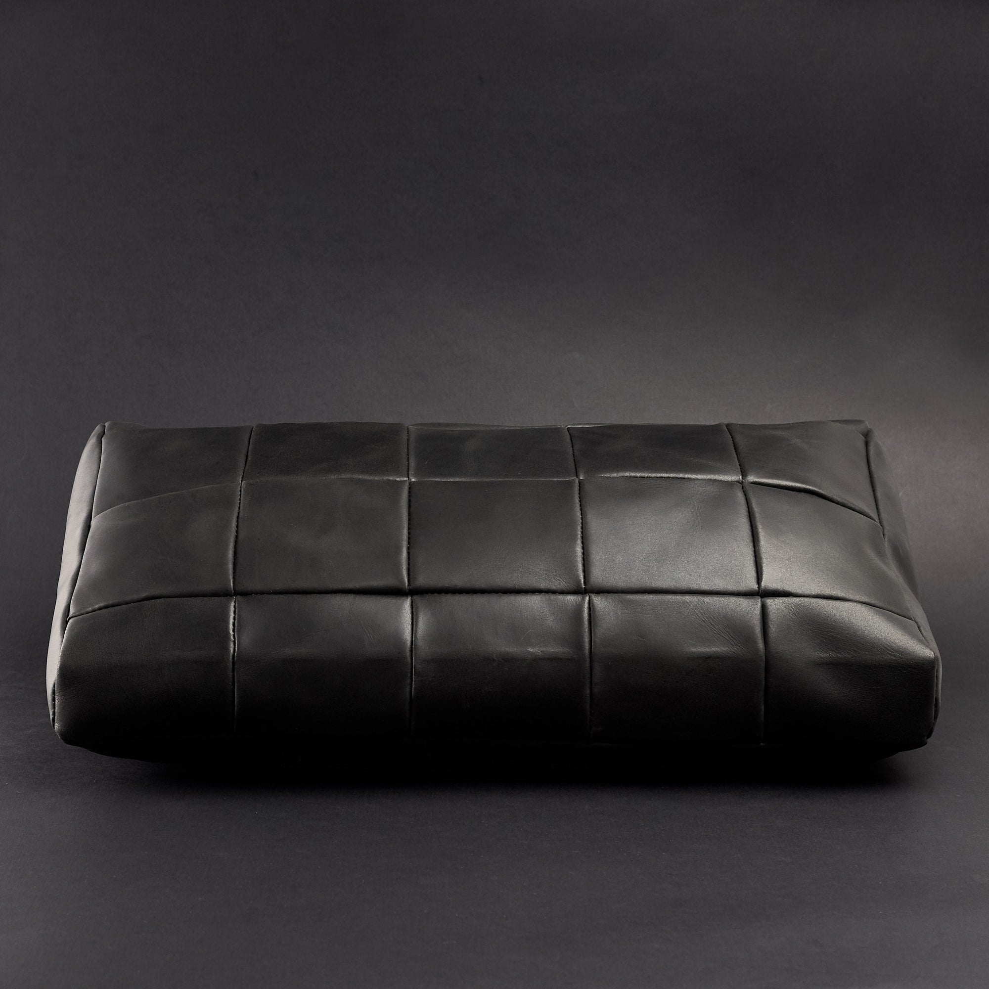 Front. Ergonomic under desk footrest cover in black by Capra Leather