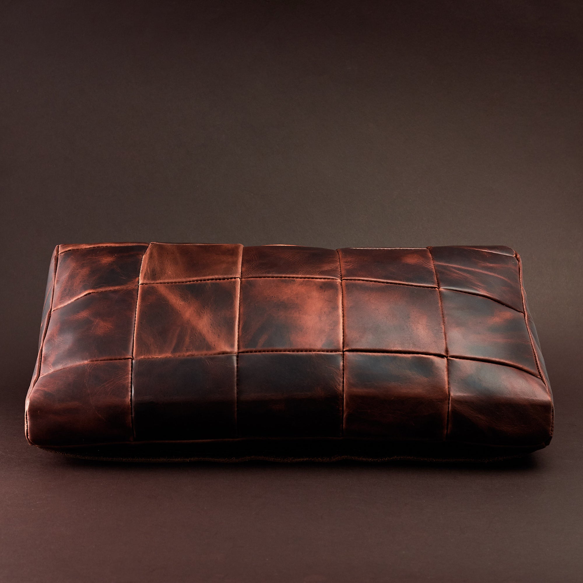 Front. Ergonomic under desk footrest cover in distressed cognac by Capra Leather