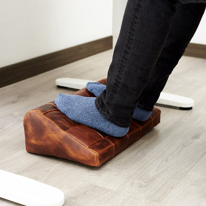 Cover. Ergonomic under desk footrest cover in distressed tan by Capra Leather