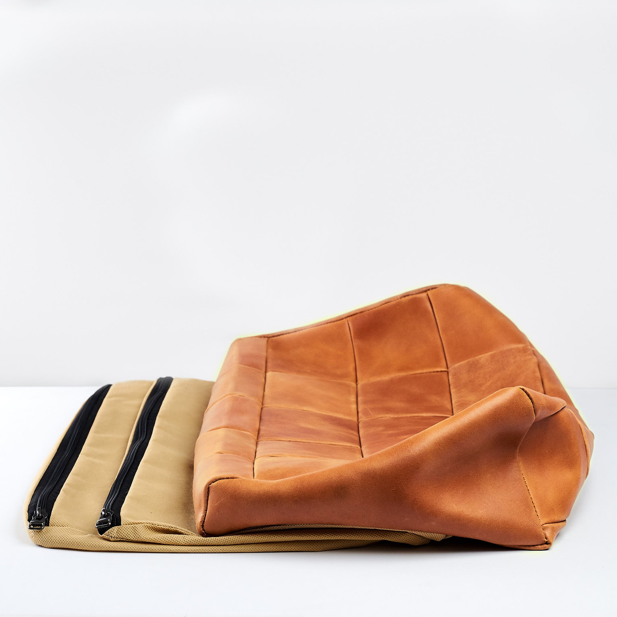 Inner Bags and Cover. Ergonomic under desk footrest cover in distressed tan by Capra Leather