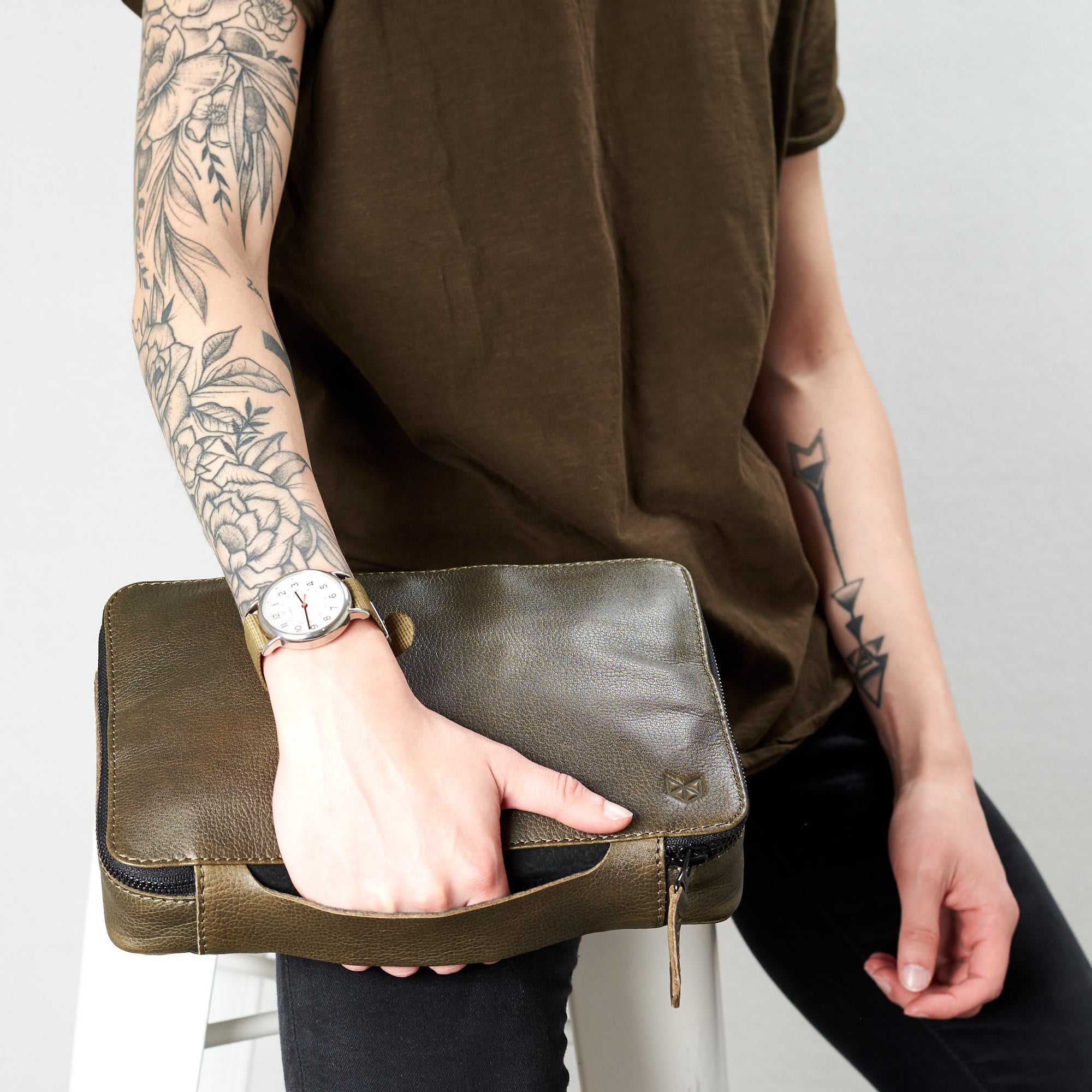Style holding handle for gadget bag. Green tech gear zipper bag by Capra Leather.