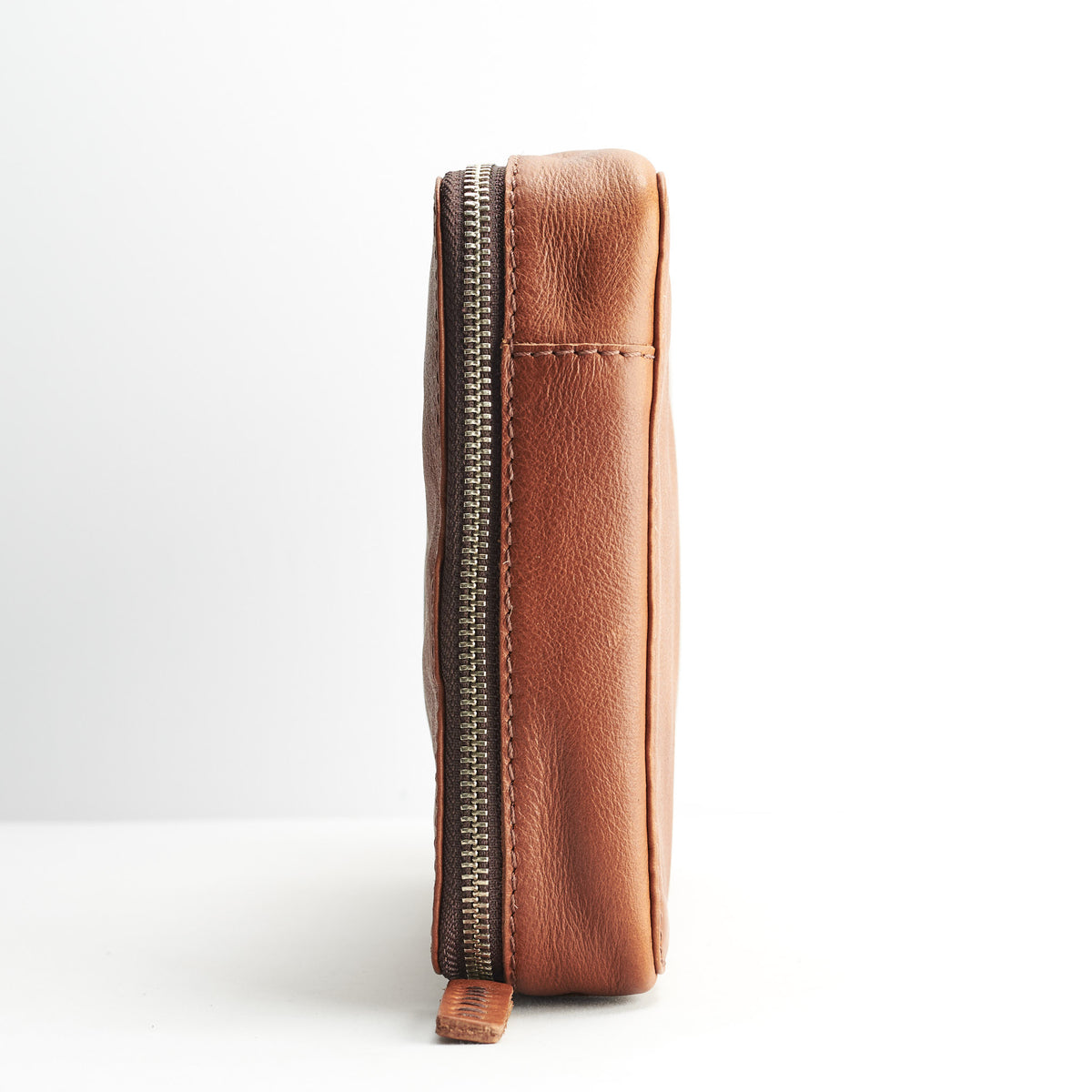 Slim profile. Tan tech gear zipper bag. Gear bag by Capra Leather