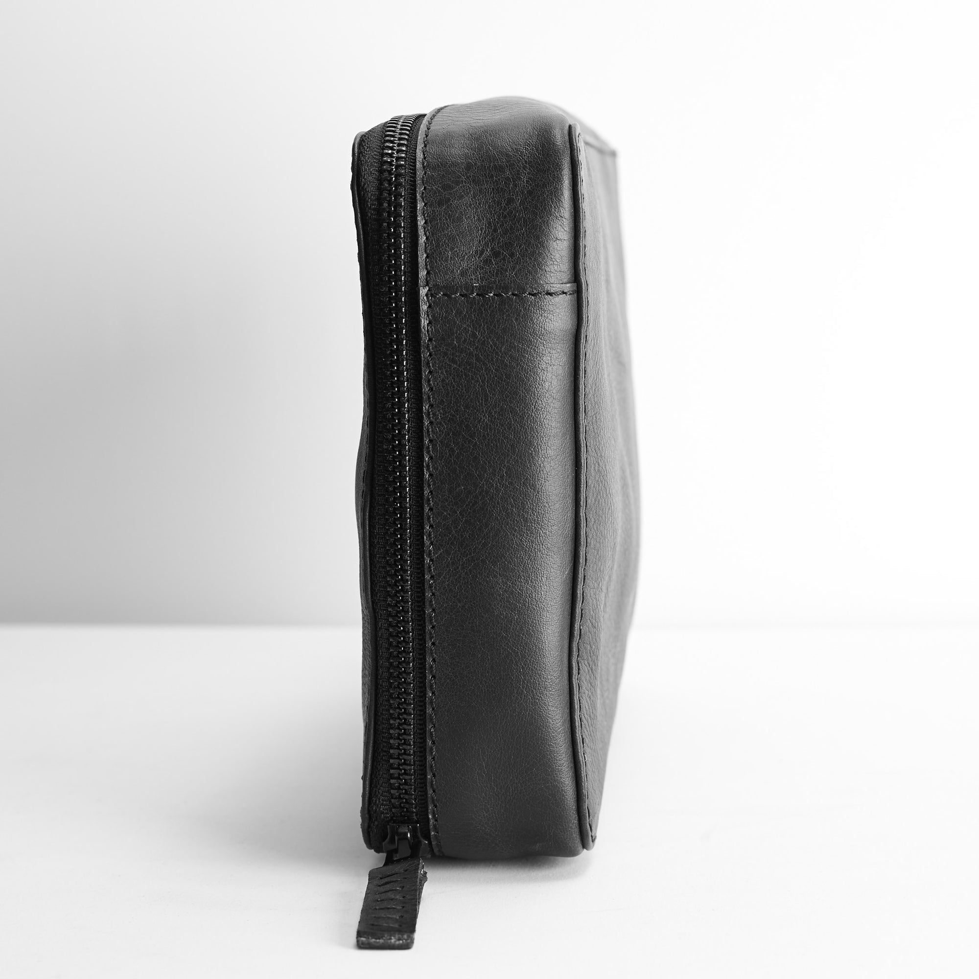 Slim profile. Black tech gear zipper bag. Gear pouch by Capra Leather