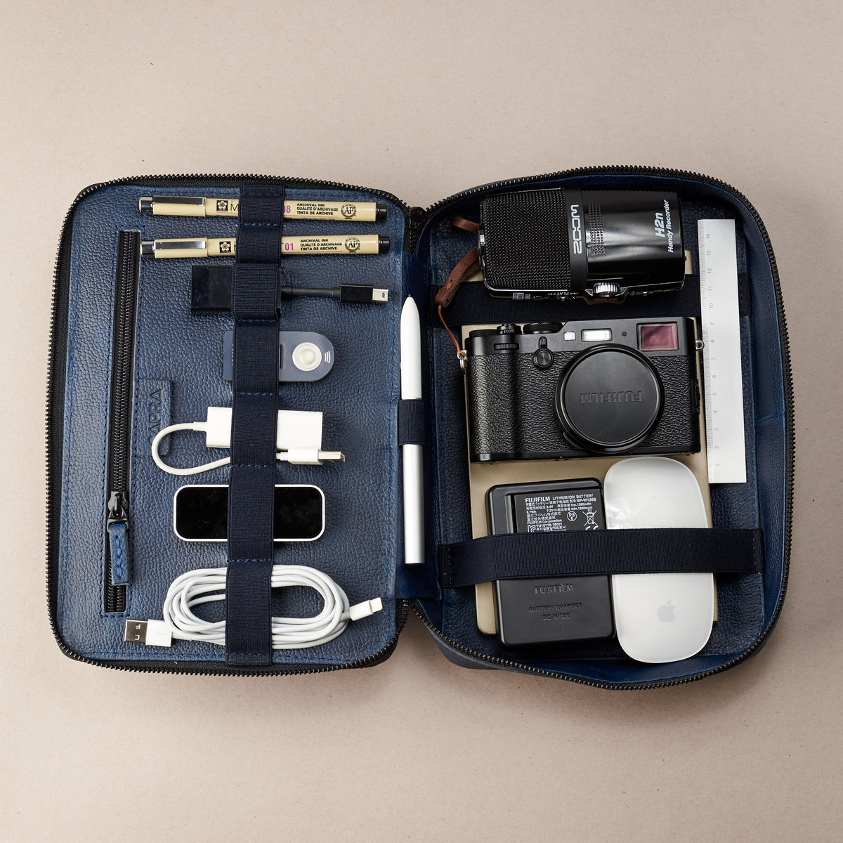 Tech essentials. Navy blue electronic organizer by Capra Leather