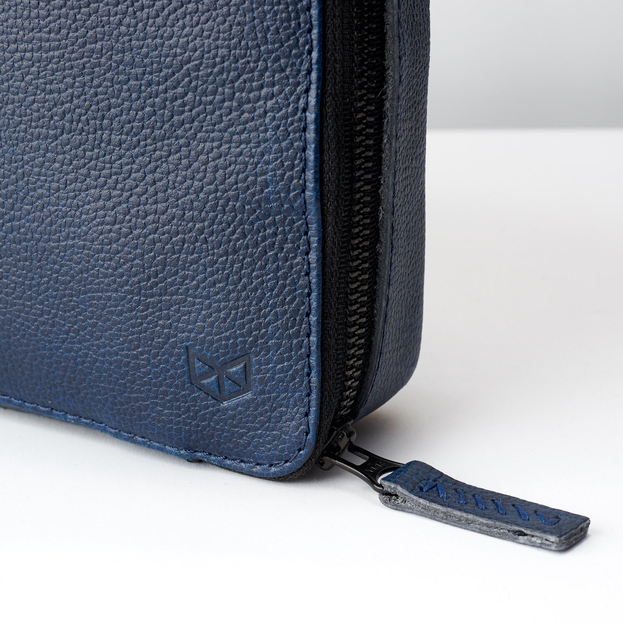 Hand stitched pull tabs. Best travel tech organizer navy blue by Capra Leather
