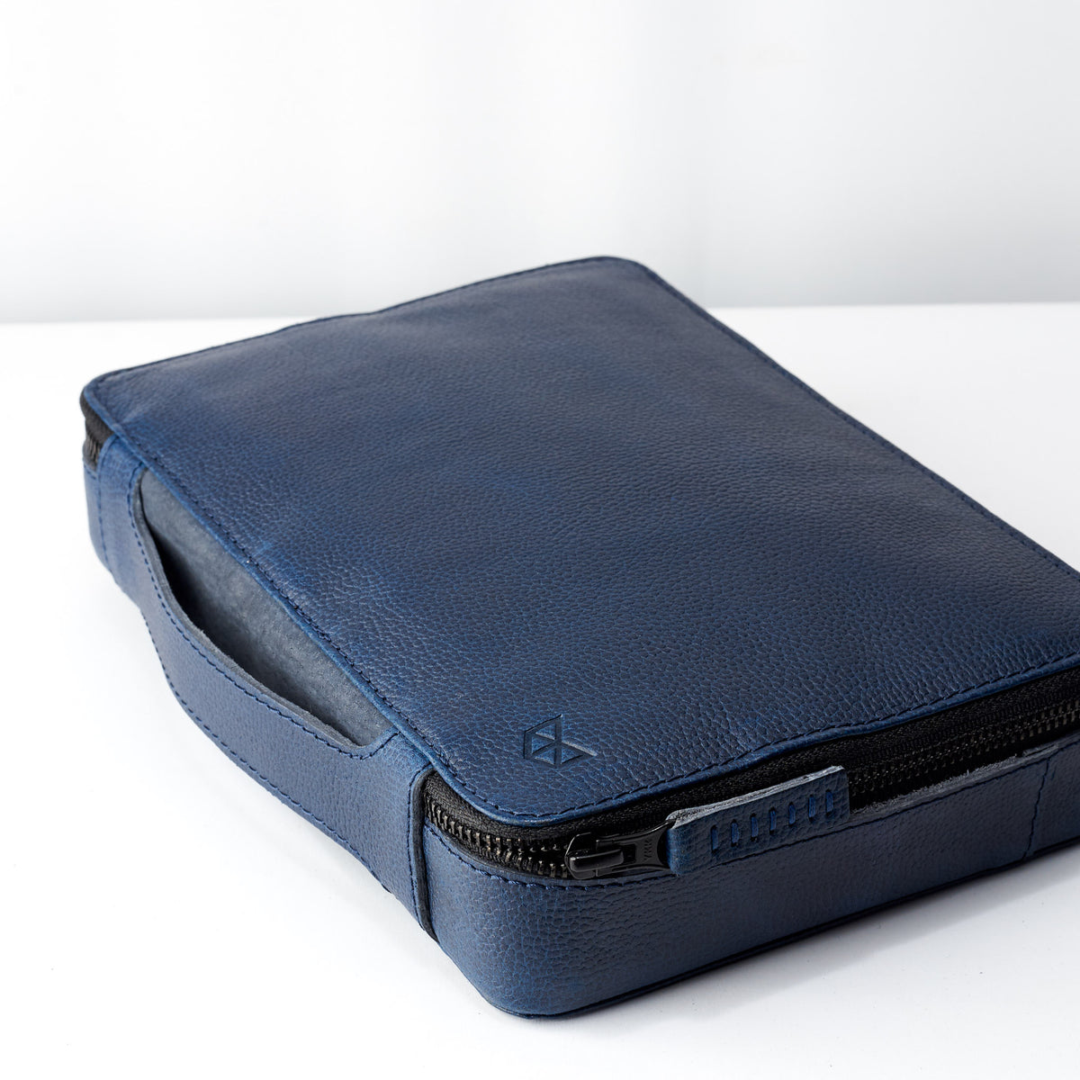 Navy leather gadget bag with handle. Best tech organizer bag for travel by Capra Leather. Fits iPad Pro with Apple pencil