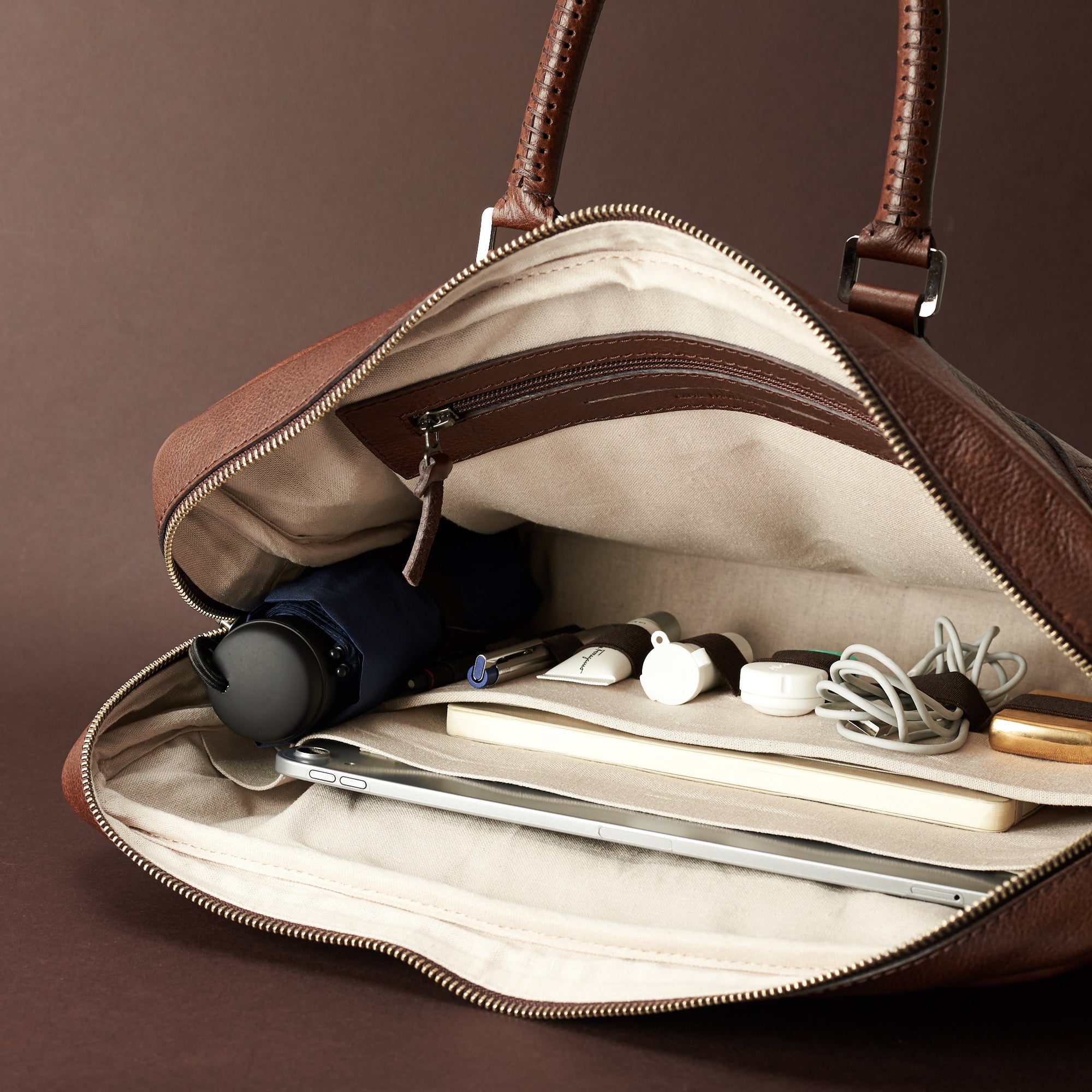 Interior in use .Brown leather briefcase laptop bag for men. Gazeli laptop briefcase by Capra Leather.