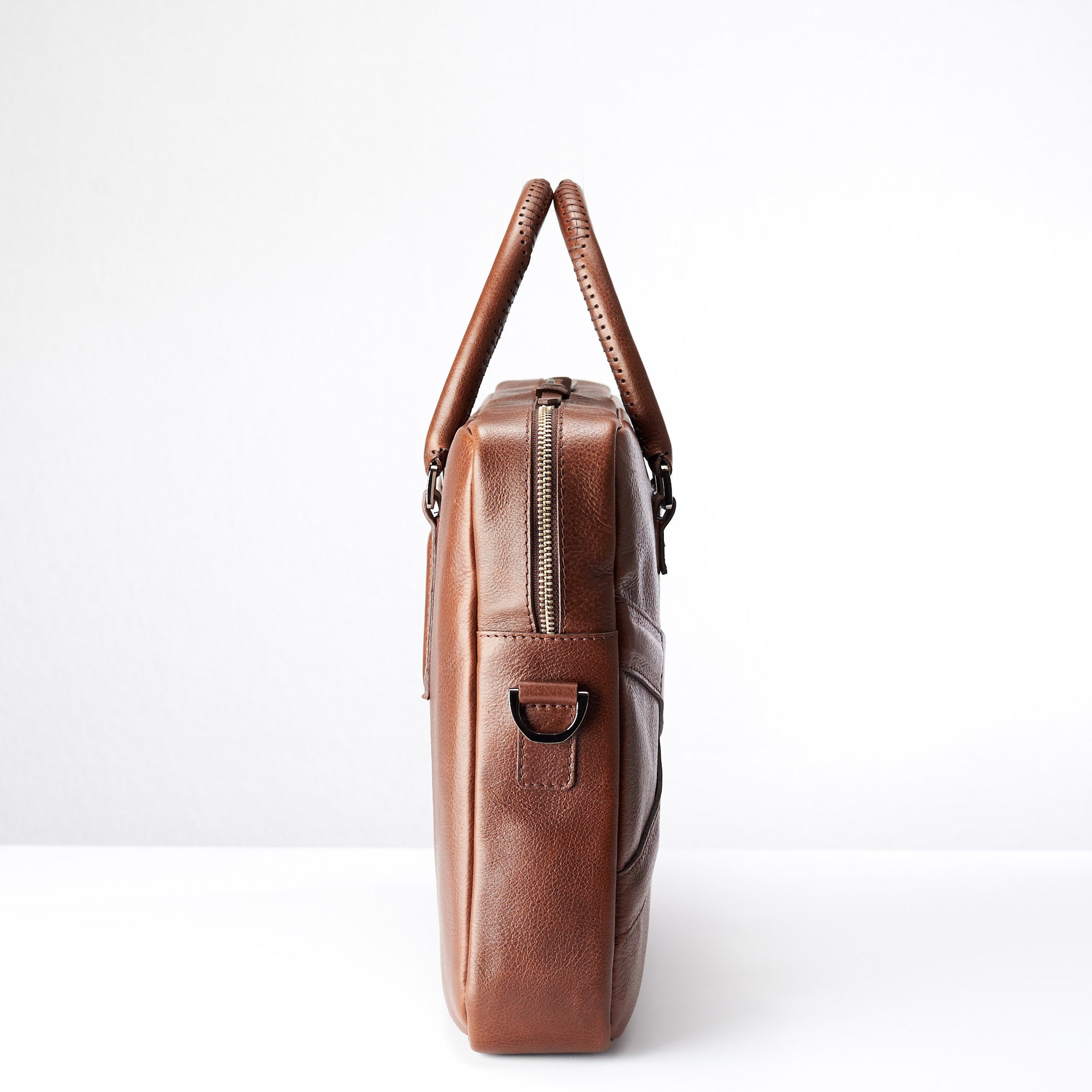 Side view of soft office and workbag .Brown leather briefcase laptop bag for men. Gazeli laptop briefcase by Capra Leather.