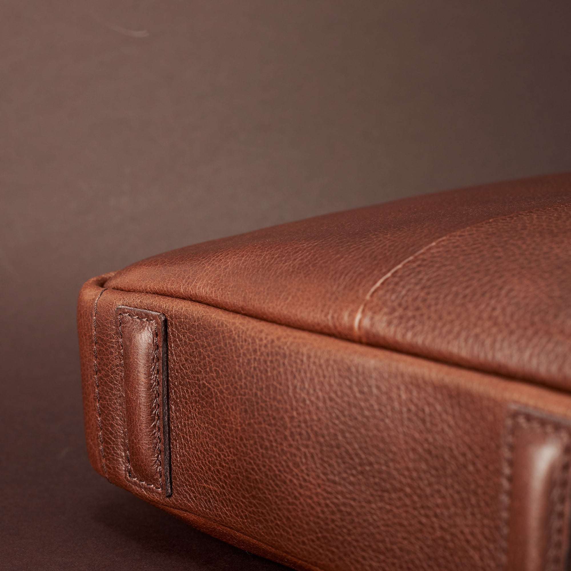 Bottom leather feet detail. Brown leather briefcase laptop bag for men. Gazeli laptop briefcase by Capra Leather.