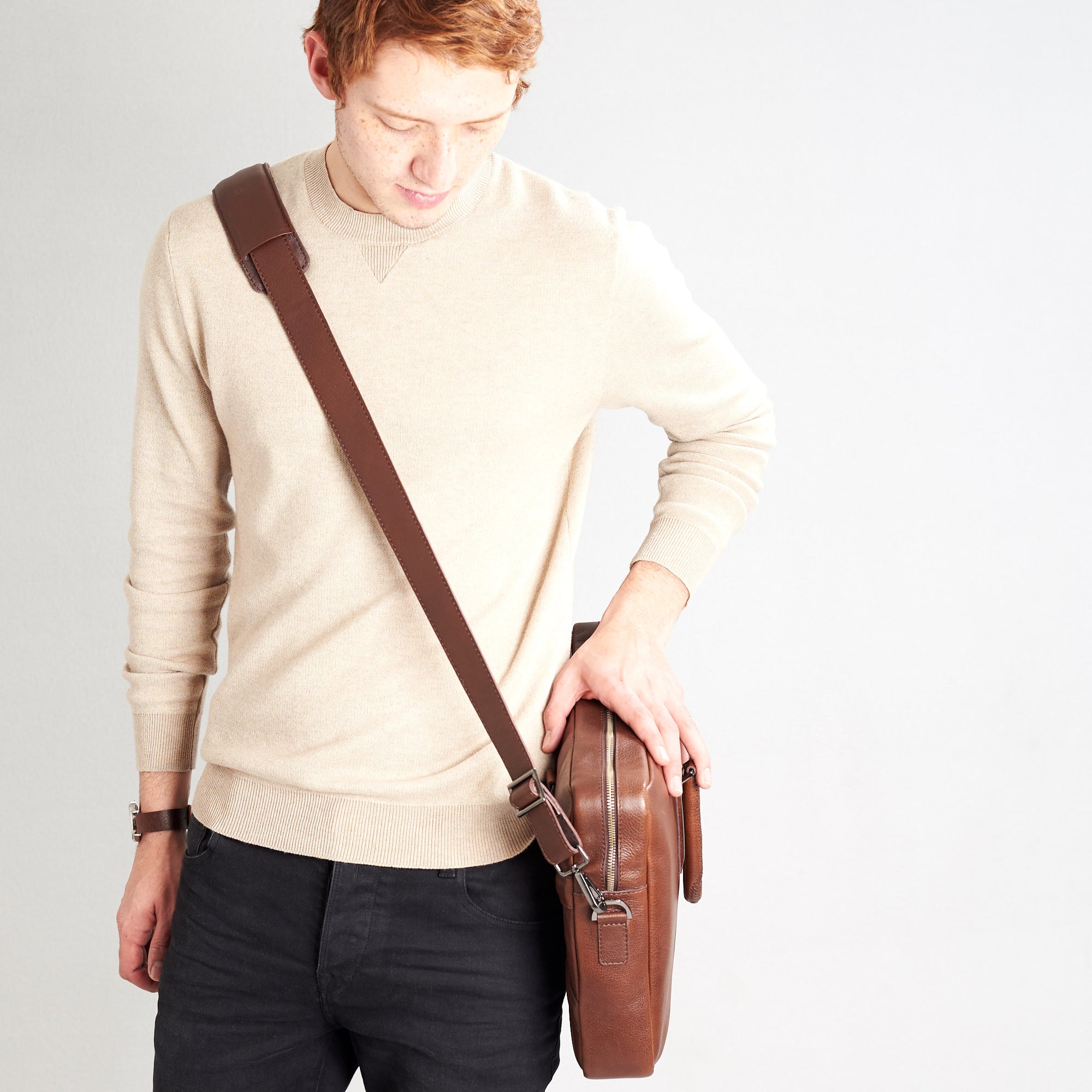 Shoulder bag in use side view of workbag. Brown leather briefcase laptop bag for men. Gazeli laptop briefcase by Capra Leather.