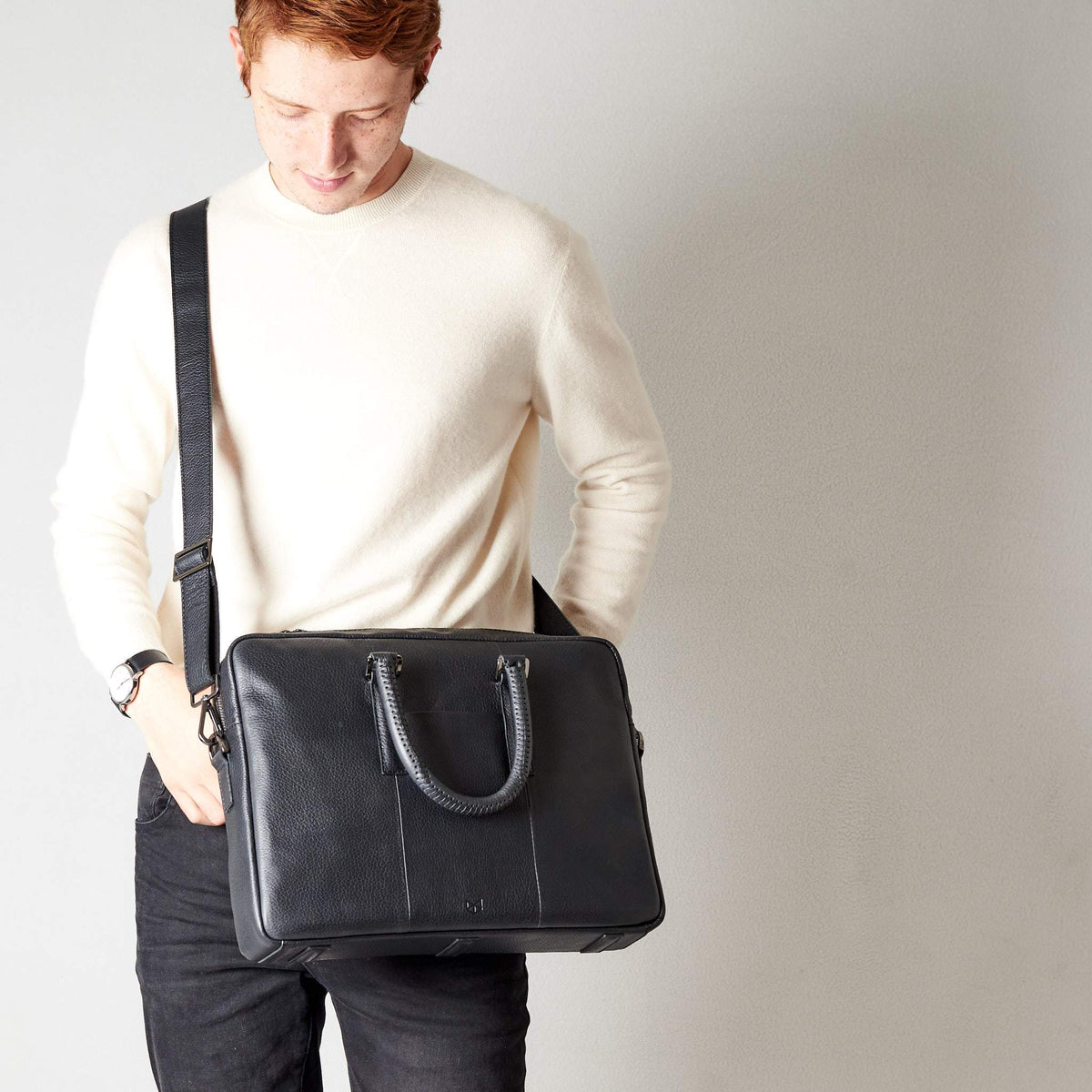 Shoulder bag in use side view of workbag. Black leather briefcase laptop bag for men. Gazeli laptop briefcase by Capra Leather.
