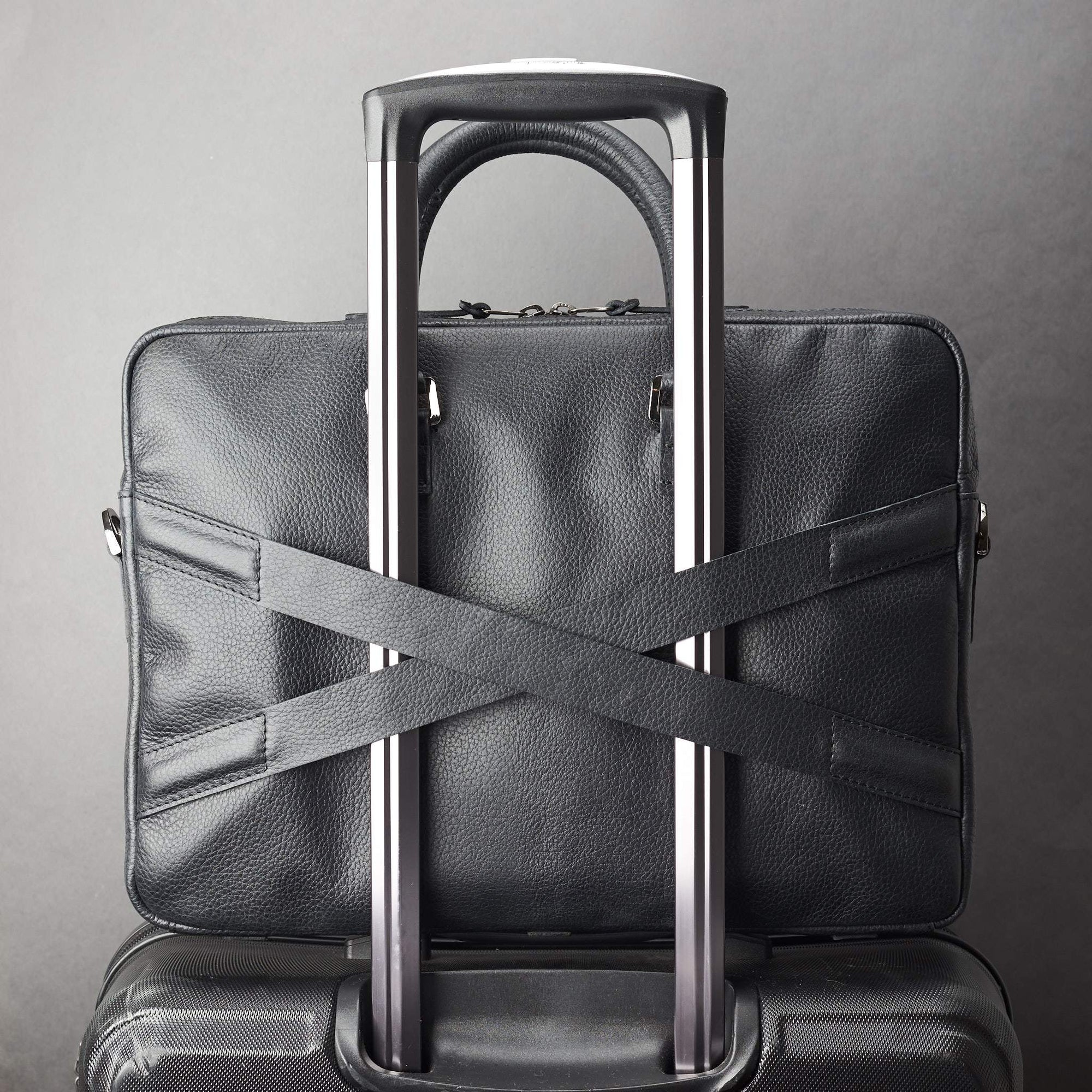 Luggage strap in x shape for messenger bag. Black leather briefcase laptop bag for men. Gazeli laptop briefcase by Capra Leather.