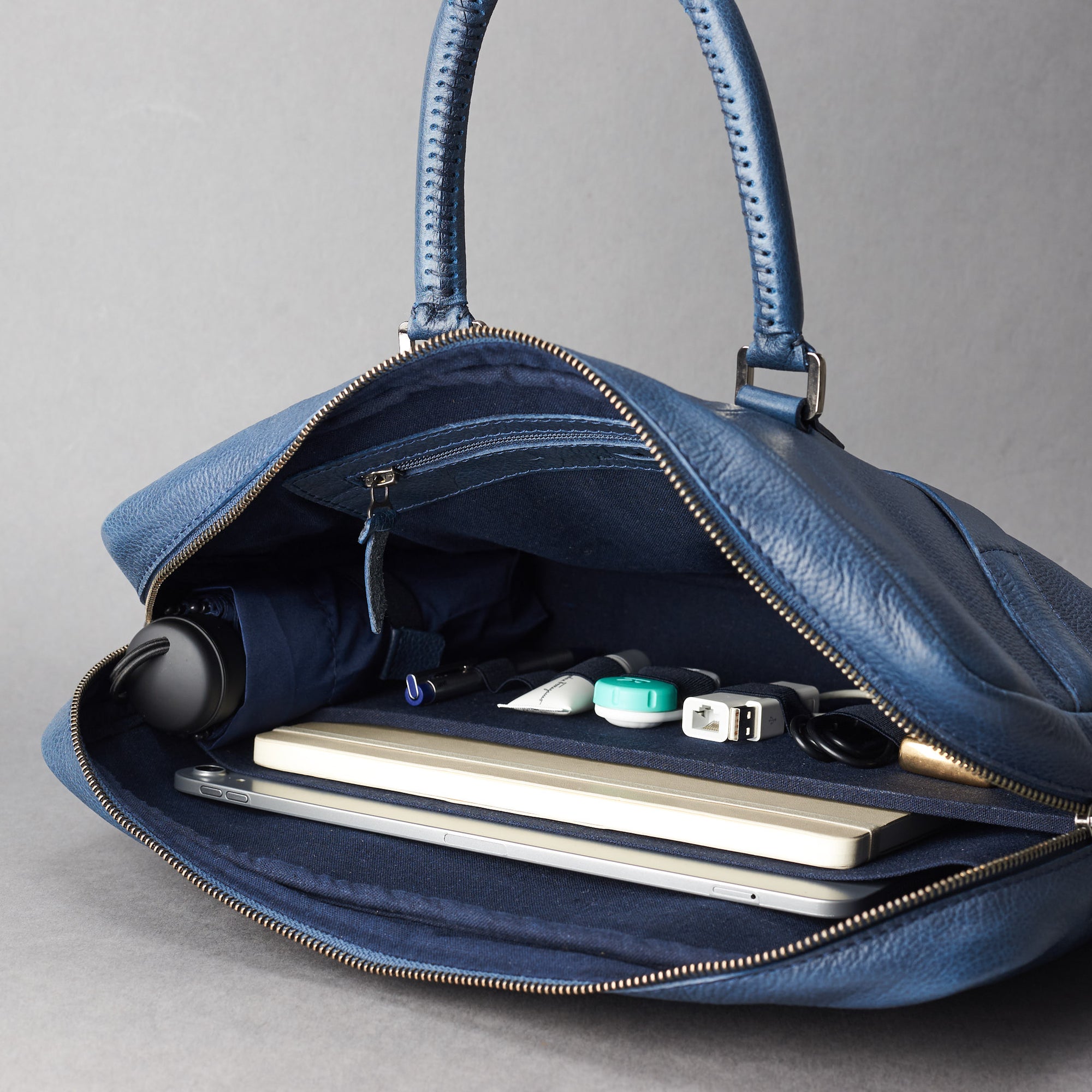 Interior in use .Blue leather briefcase laptop bag for men. Gazeli laptop briefcase by Capra Leather.