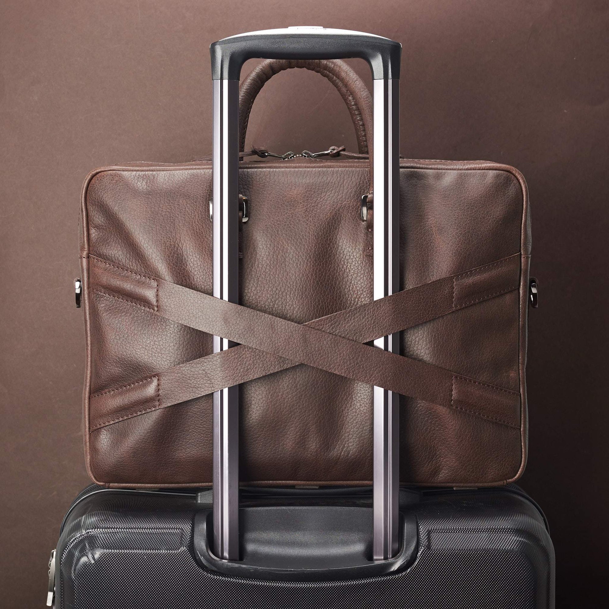 Luggage strap in x shape for messenger bag. Dark Brown leather briefcase laptop bag for men. Gazeli laptop briefcase by Capra Leather.