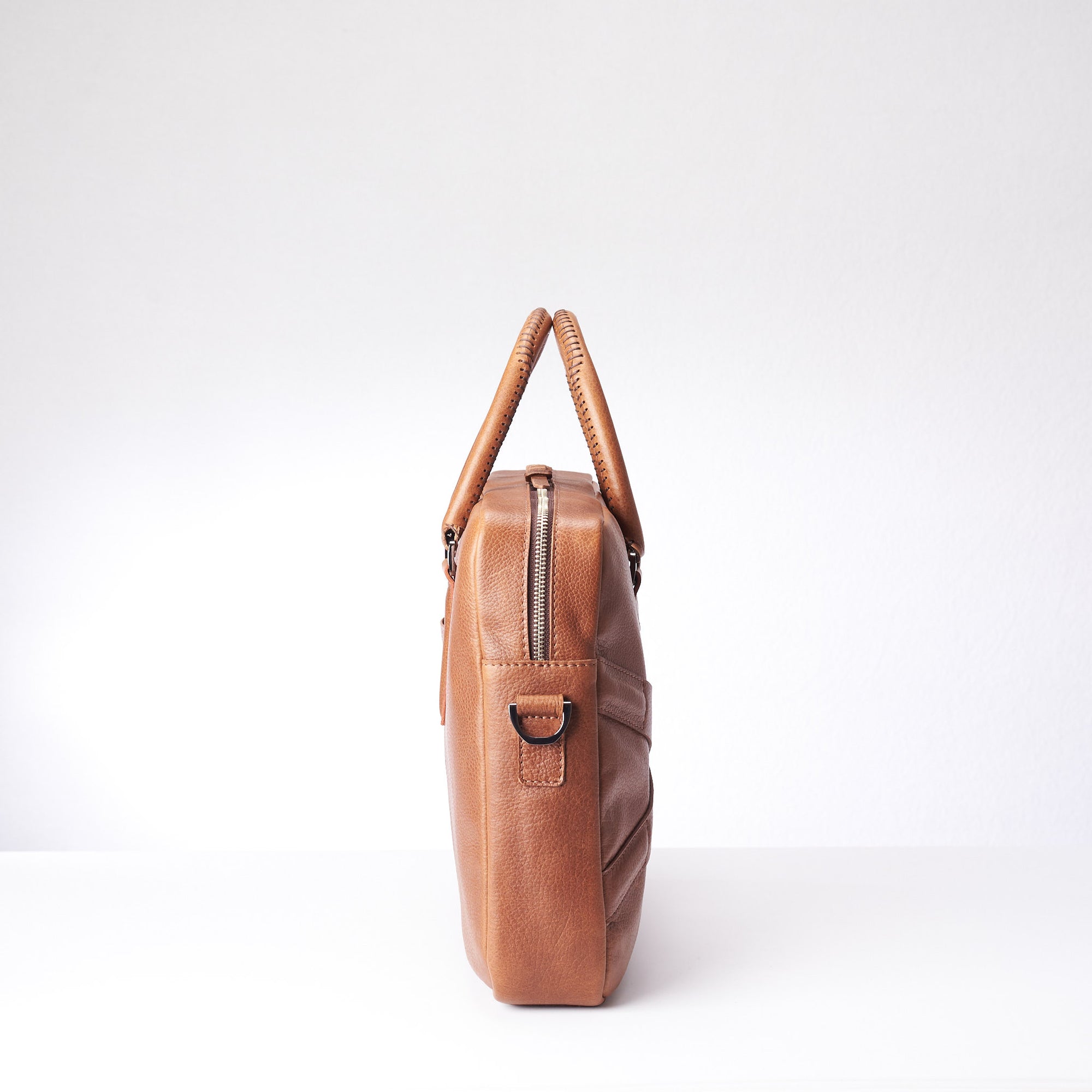 Side view of soft office and workbag .Tan leather briefcase laptop bag for men. Gazeli laptop briefcase by Capra Leather.