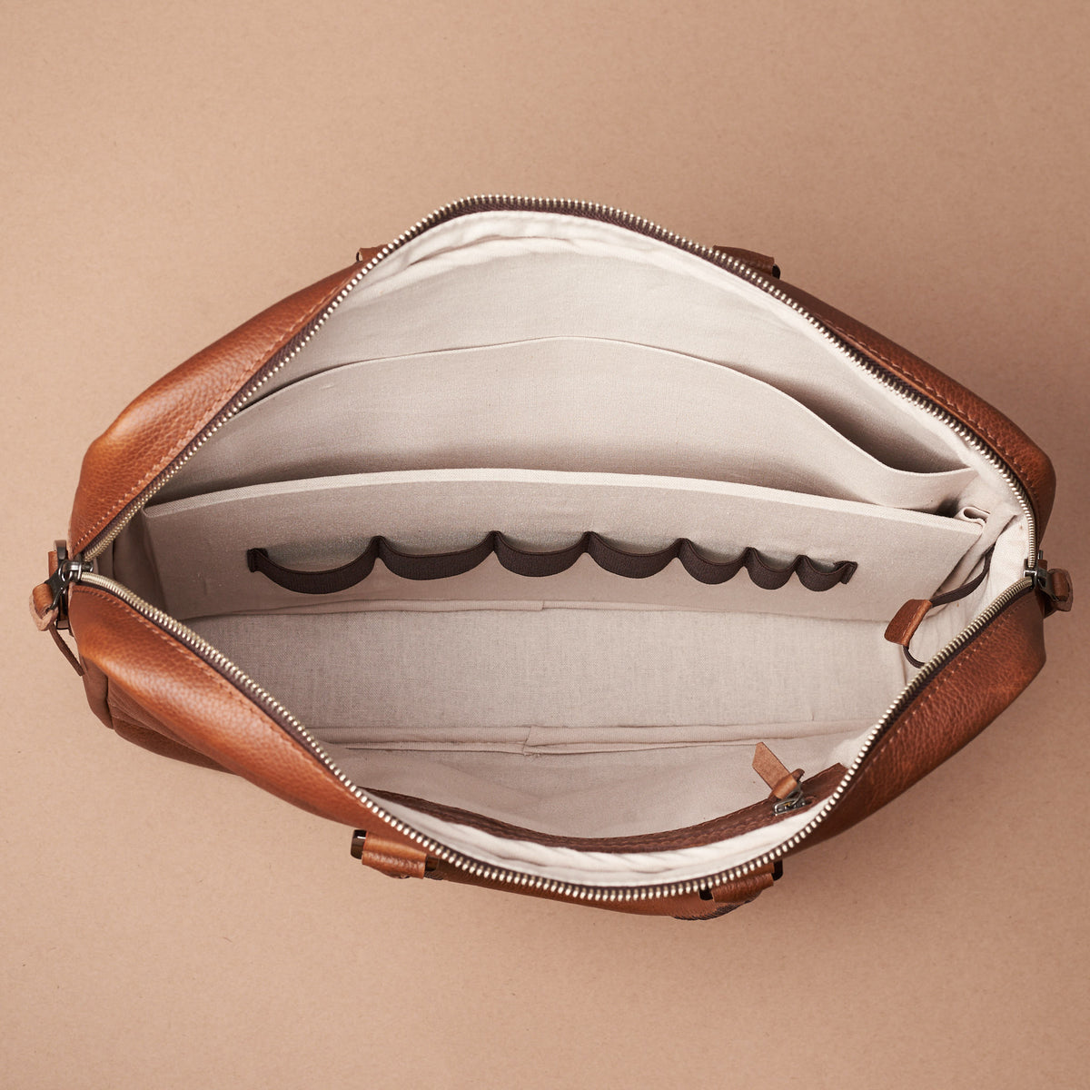 Interior with 7 division slots .Tan leather briefcase laptop bag for men. Gazeli laptop briefcase by Capra Leather.