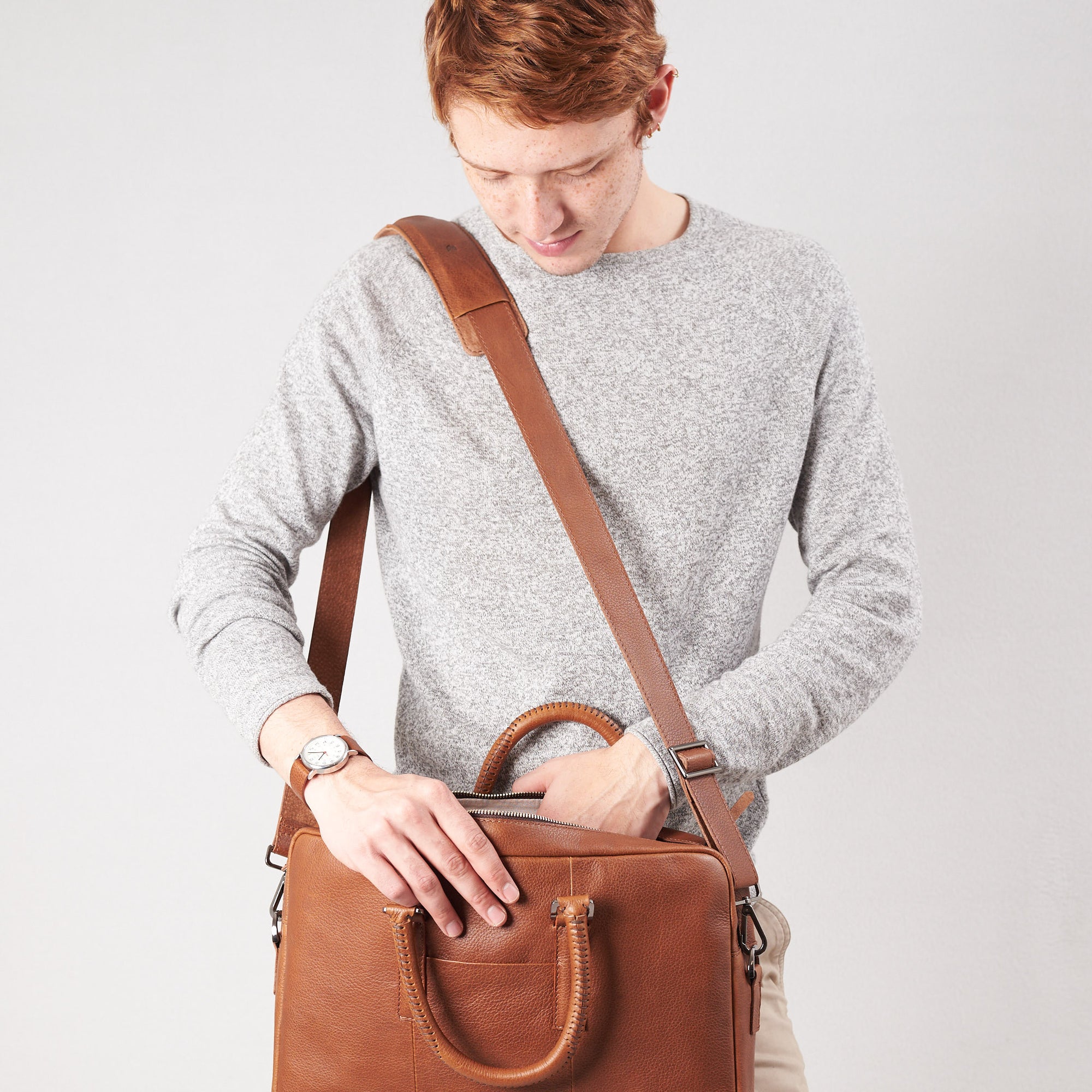 Shoulder bag in use side view of workbag. Tan leather briefcase laptop bag for men. Gazeli laptop briefcase by Capra Leather.