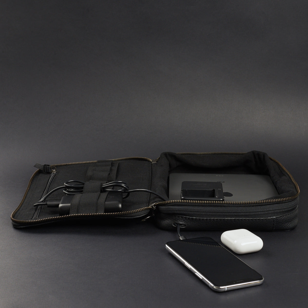 Cable passthrough. Black leather gear bag by Capra