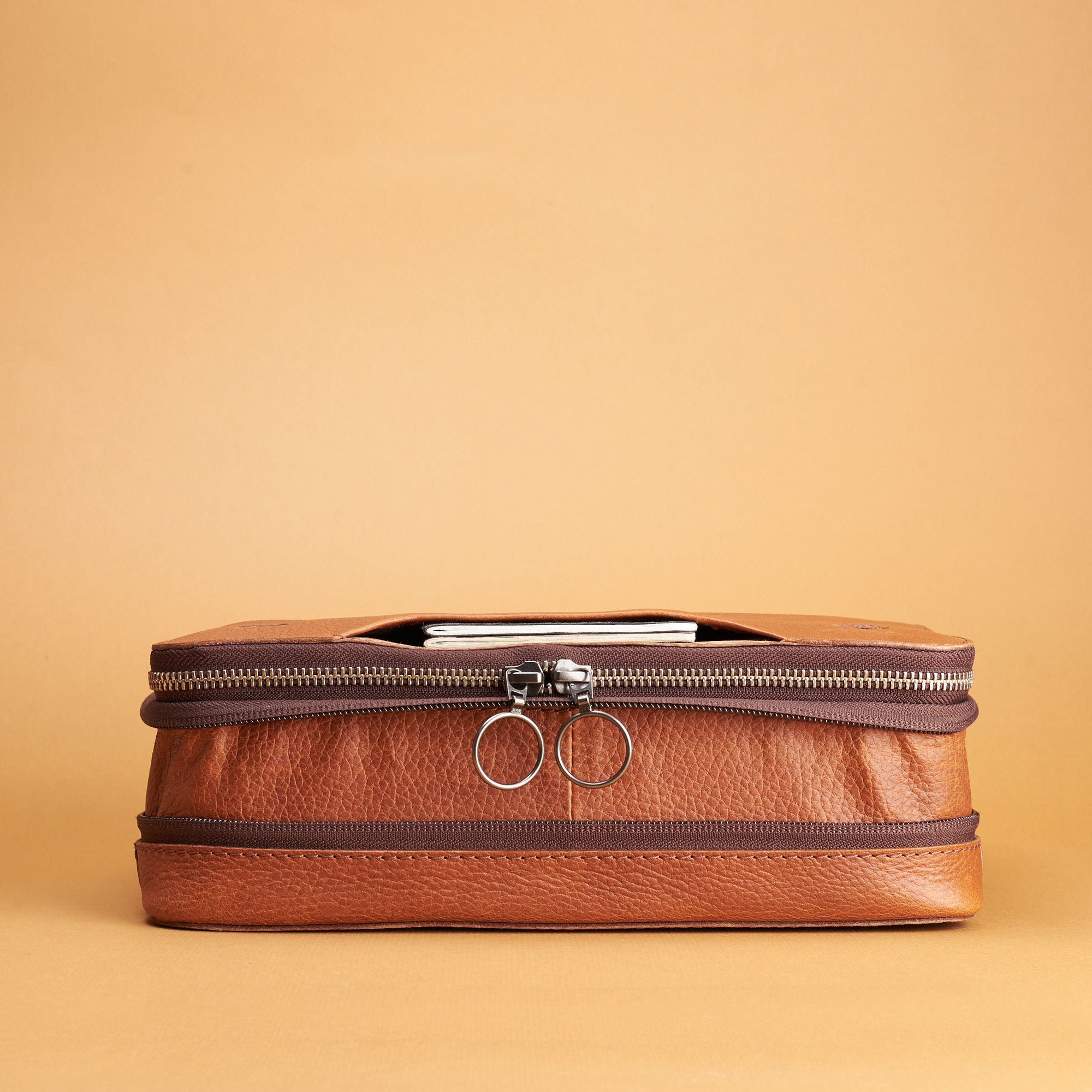 Expansion and compression system. Tan small EDC gear bag by Capra Leather