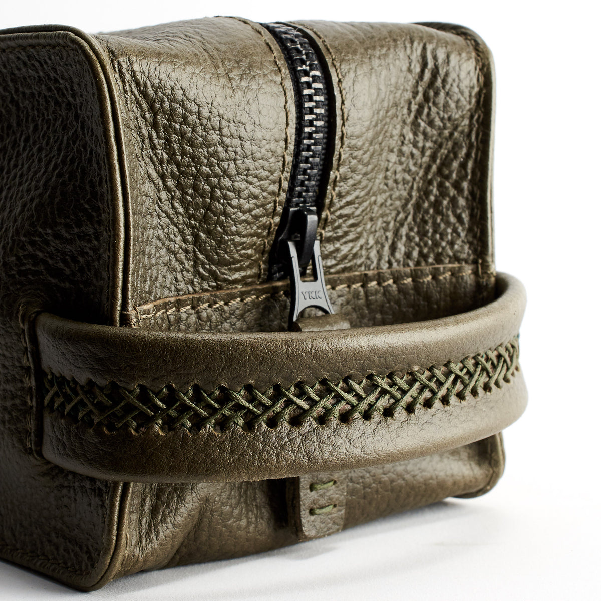Hand stitch detail. Green leather toiletry, shaving bag with hand stitched handle. Groomsmen gifts
