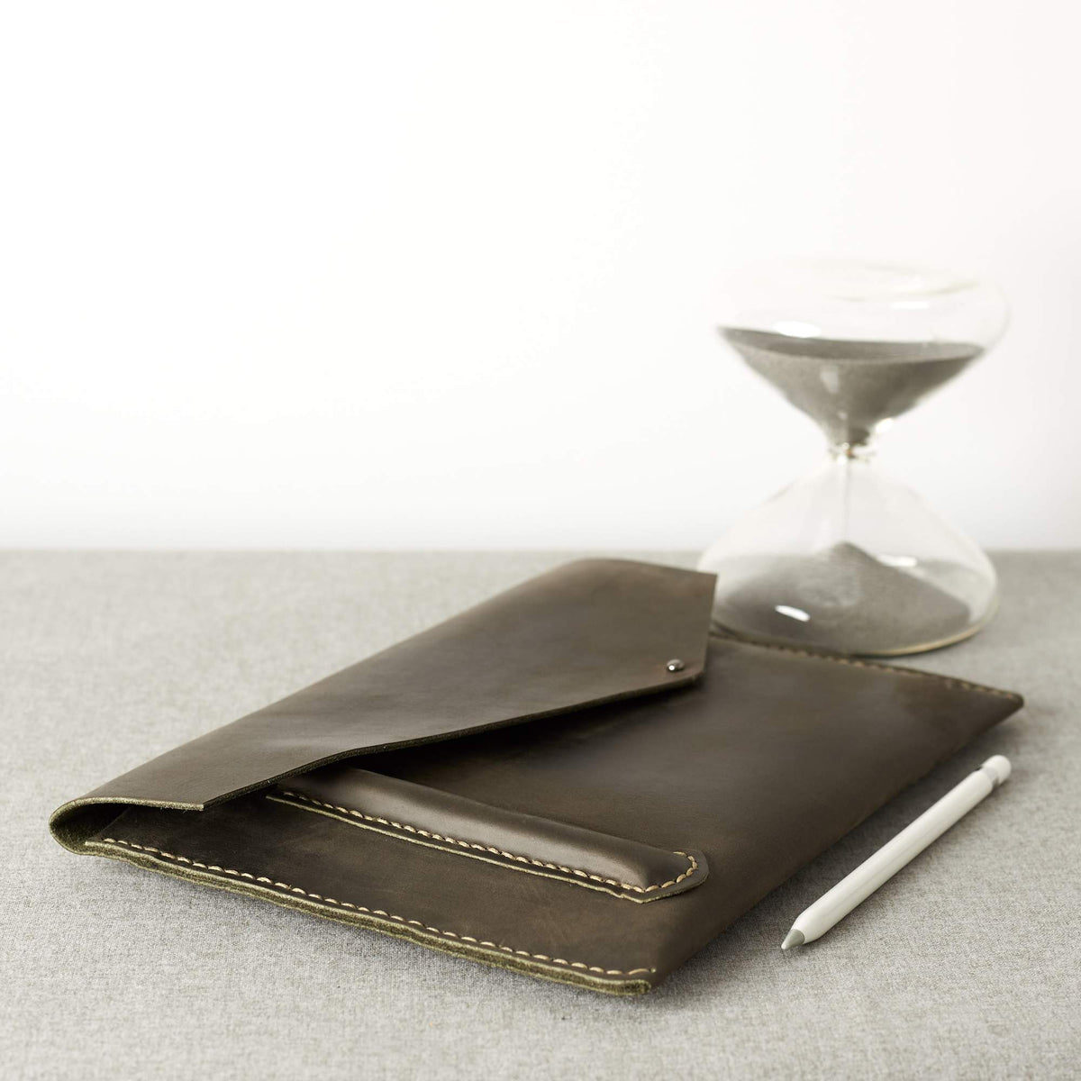 Style. Green Google Pixelbook leather sleeve with Google pen holder.