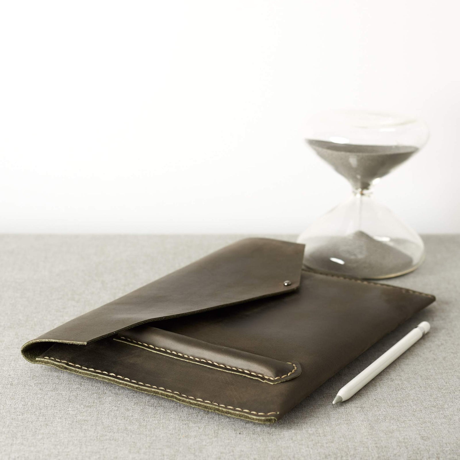 Style. Green Google Pixelbook leather sleeve with Google pen holder.