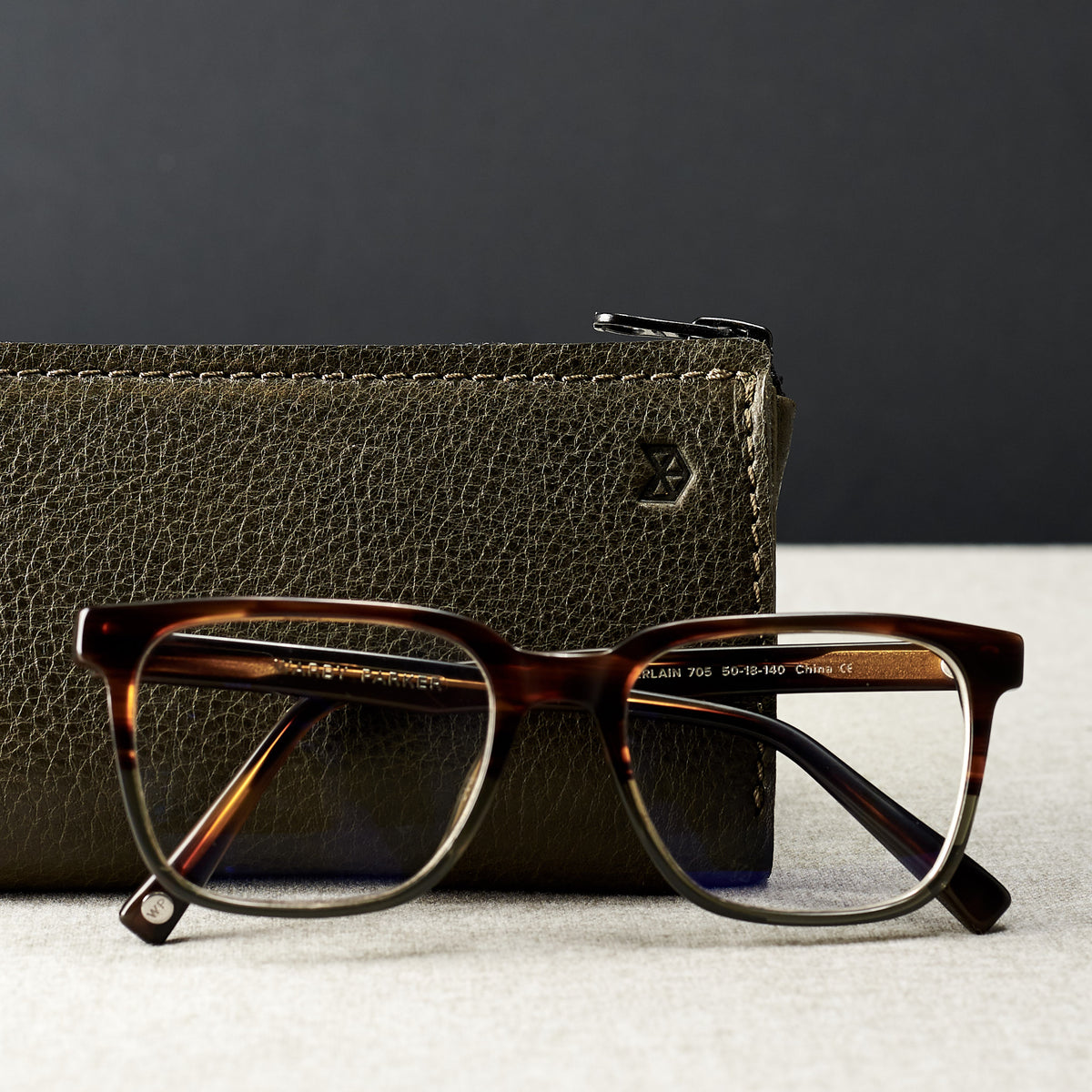 Style photo. Green leather glasses case for men. Eyewear mens leather sleeve