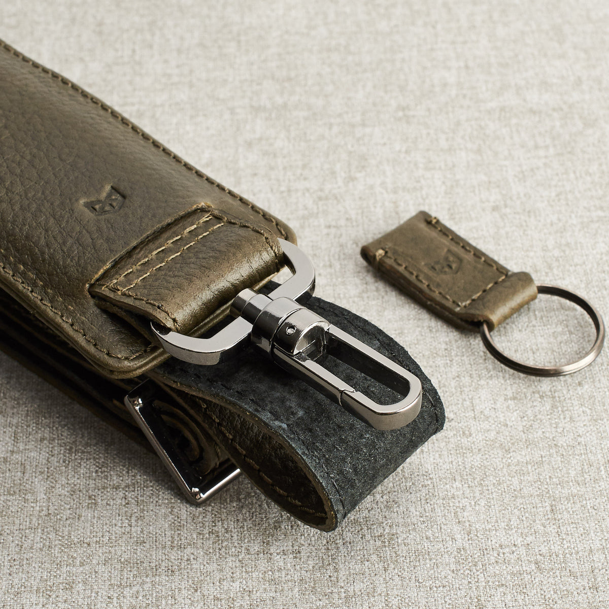 Shoulder strap and magnetic keychain. Green leather briefcase for men. Office style mens workbag