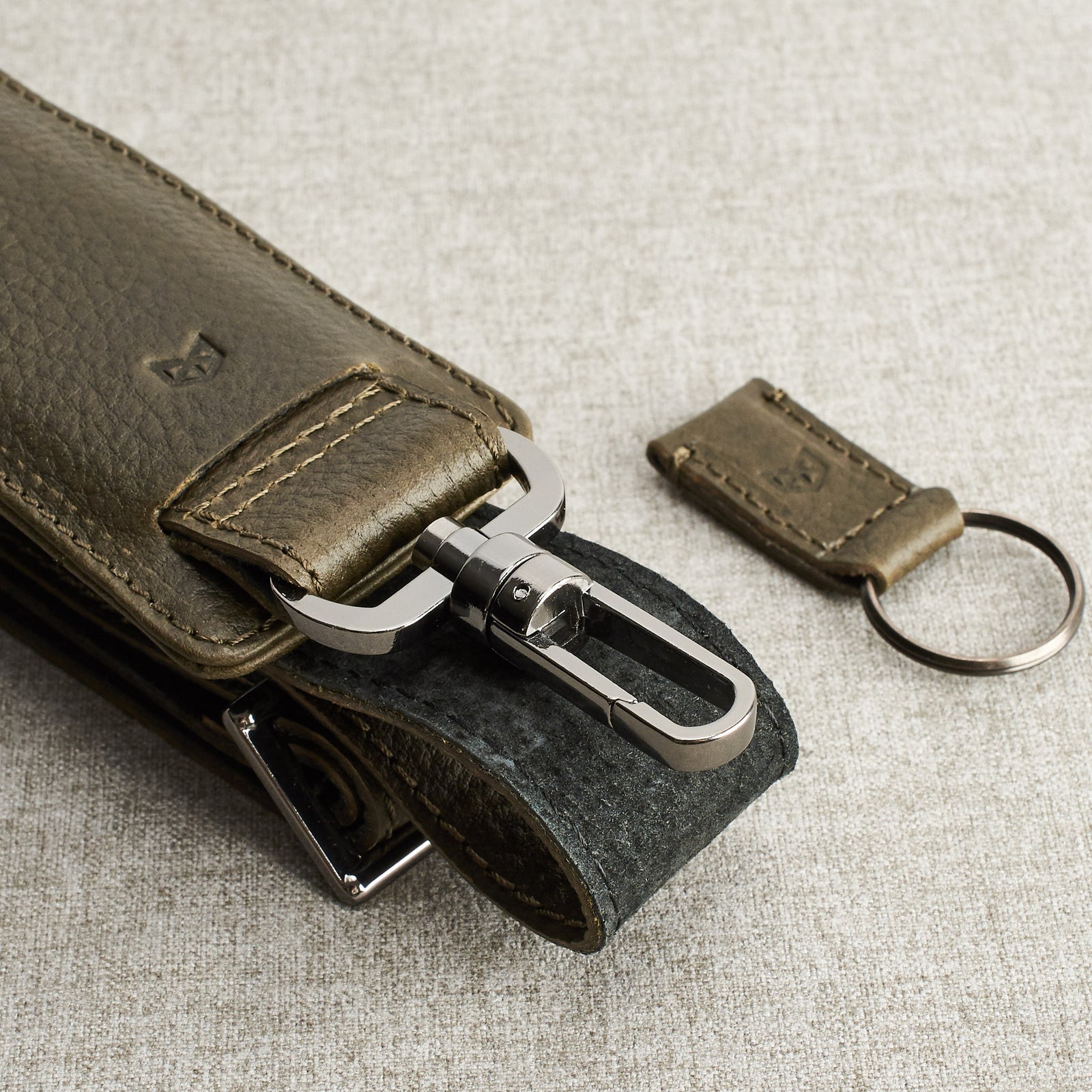 Shoulder strap and magnetic keychain. Green leather briefcase for men. Office style mens workbag