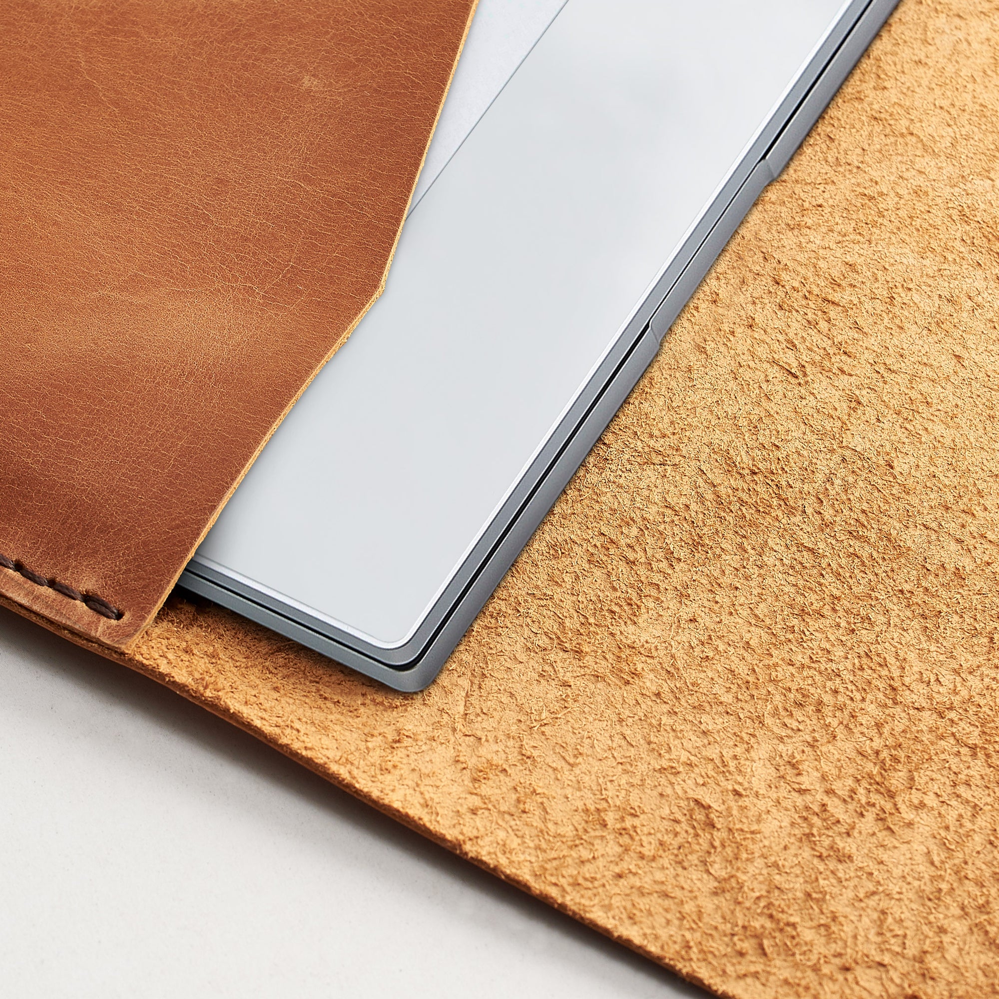 Soft interior. ASUS Zenbook Pro Duo light brown leather sleeve for men