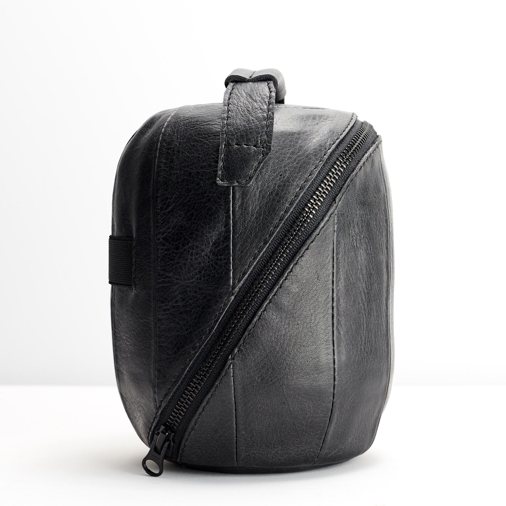 YKK metallic zippers. HomePod black leather travel carrying case.