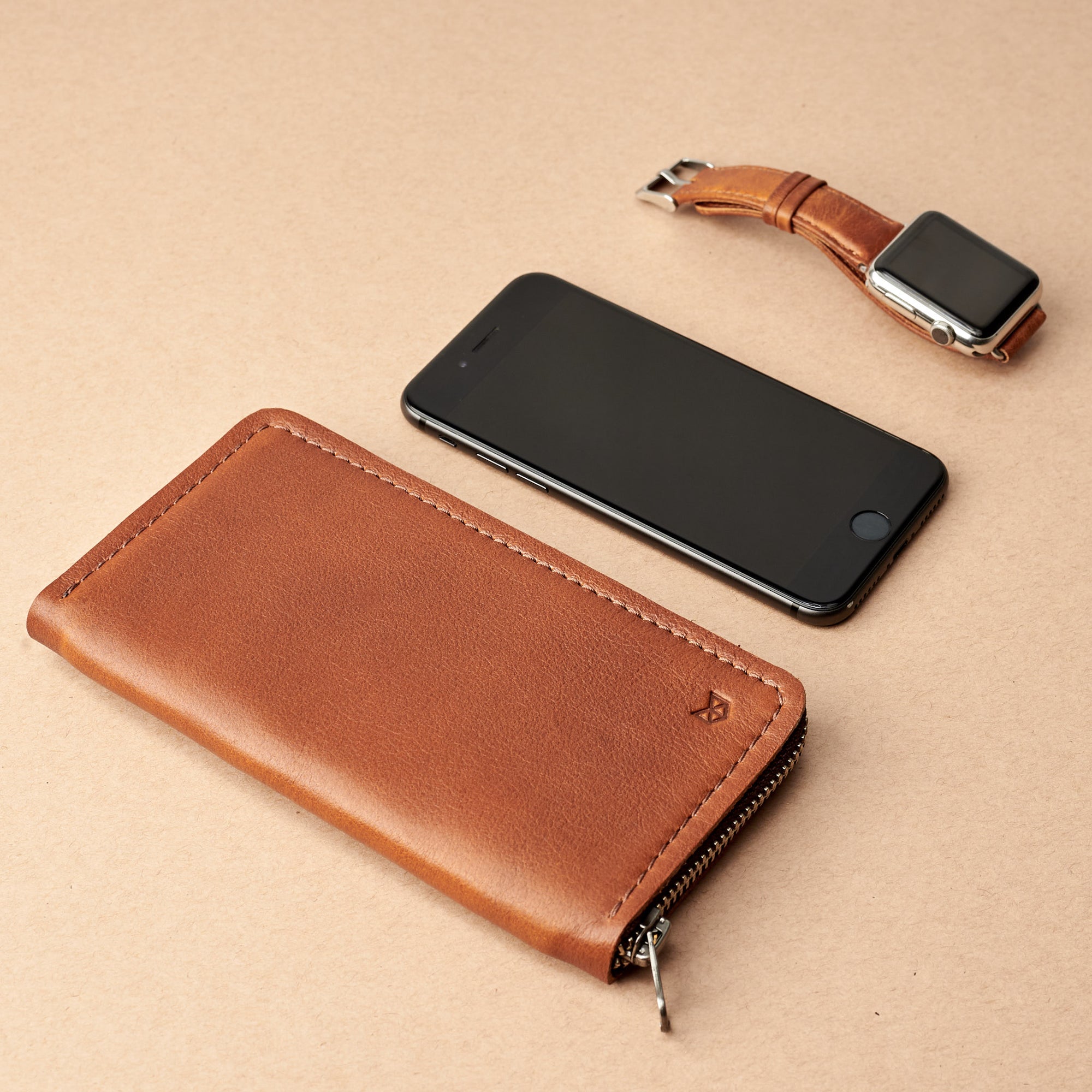 Styling Apple. Tan iPhone leather wallet stand case for mens gifts. iPhone xs, iPhone xs Max, iPhone xr, iPhone x, iPhone 10, iPhone 8 plus leather stand sleeve. Crafted by Capra Leather.