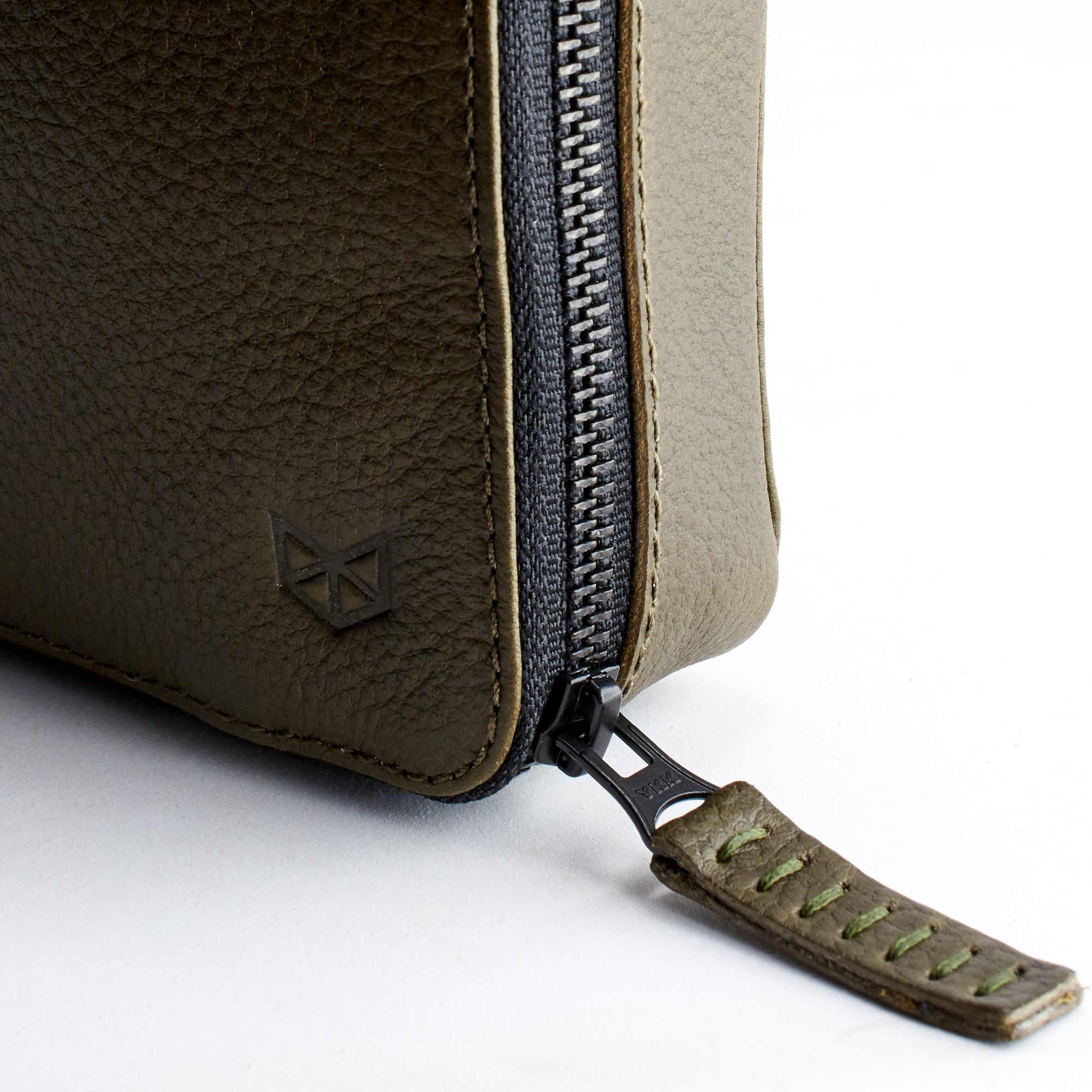 YKK metallic zippers. Green leather travel gadget bag by Capra