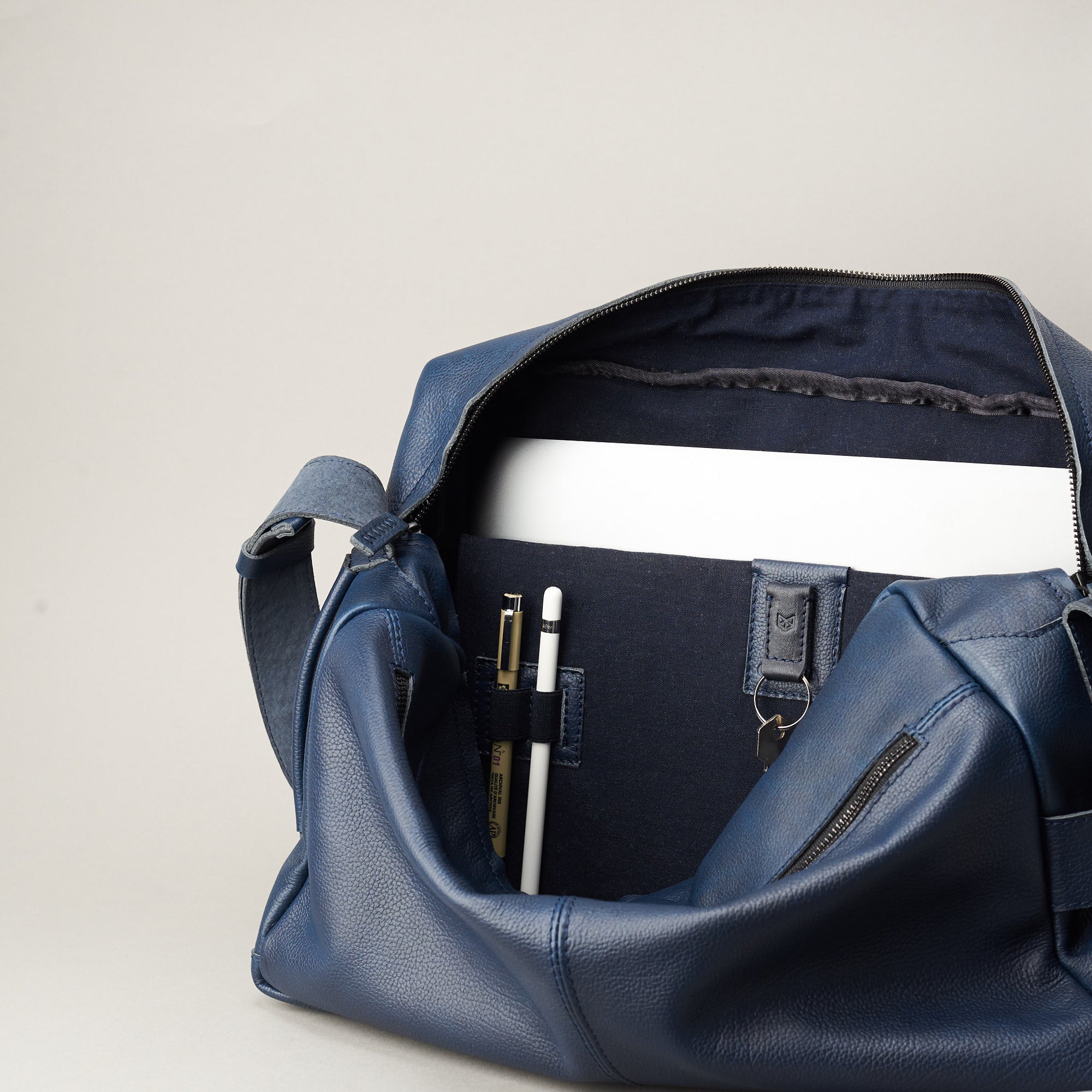 Linen Interior. Addox Blue cyclist shoulder tech bag for Men by Capra Leather